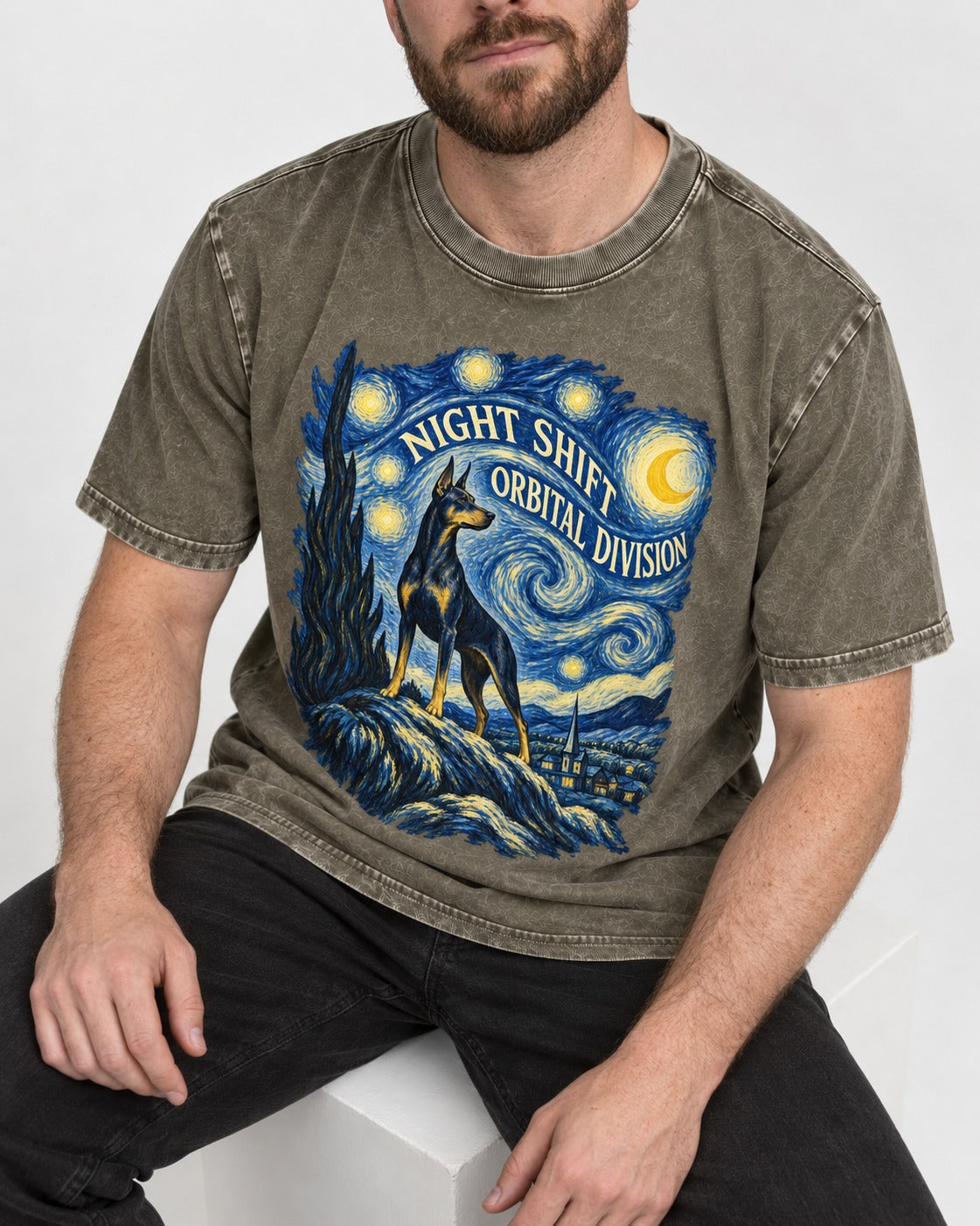 Doberman Night Shift Orbital Division Starry Night Graphic Washed Tee in Army Green, worn by a seated model