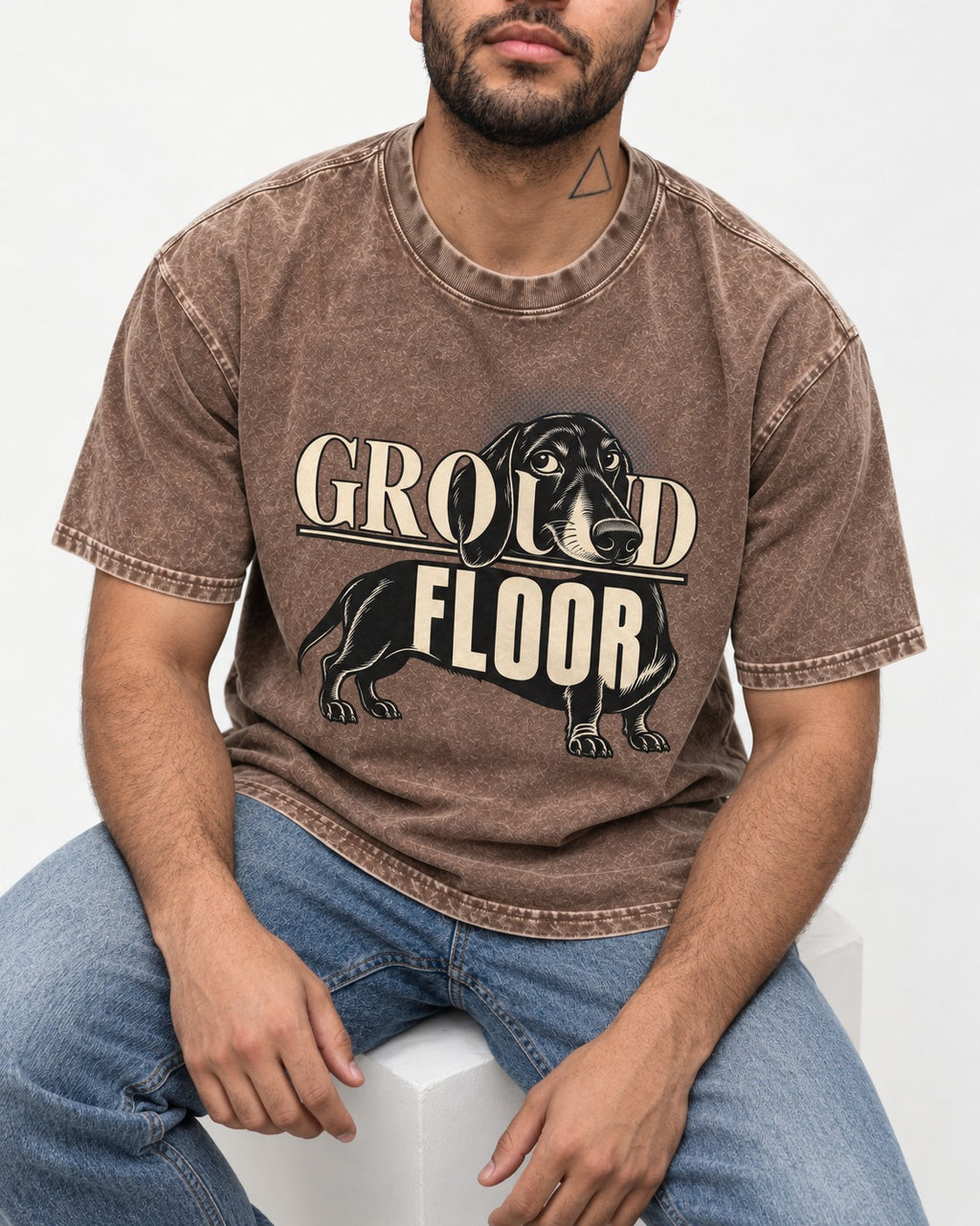 Ground Floor Dachshund Washed Tee in Coffee, worn by a seated model