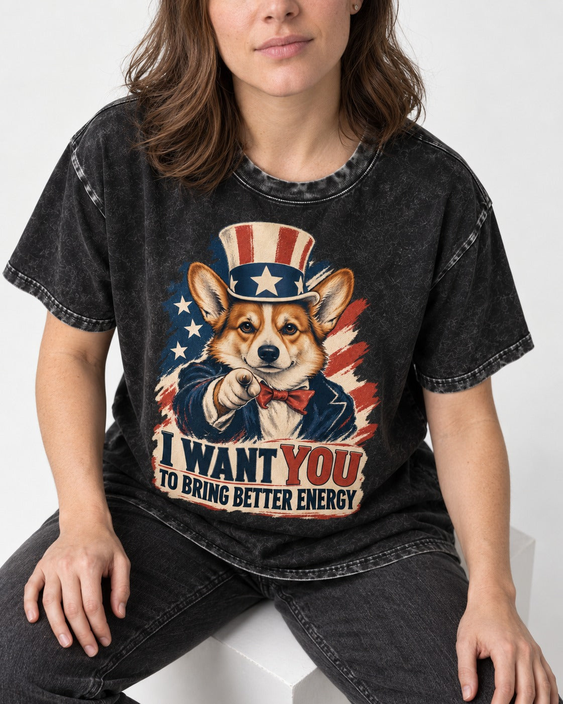 Corgi I Want You to Bring Better Energy Uncle Sam Washed Tee in Black, worn by a seated model