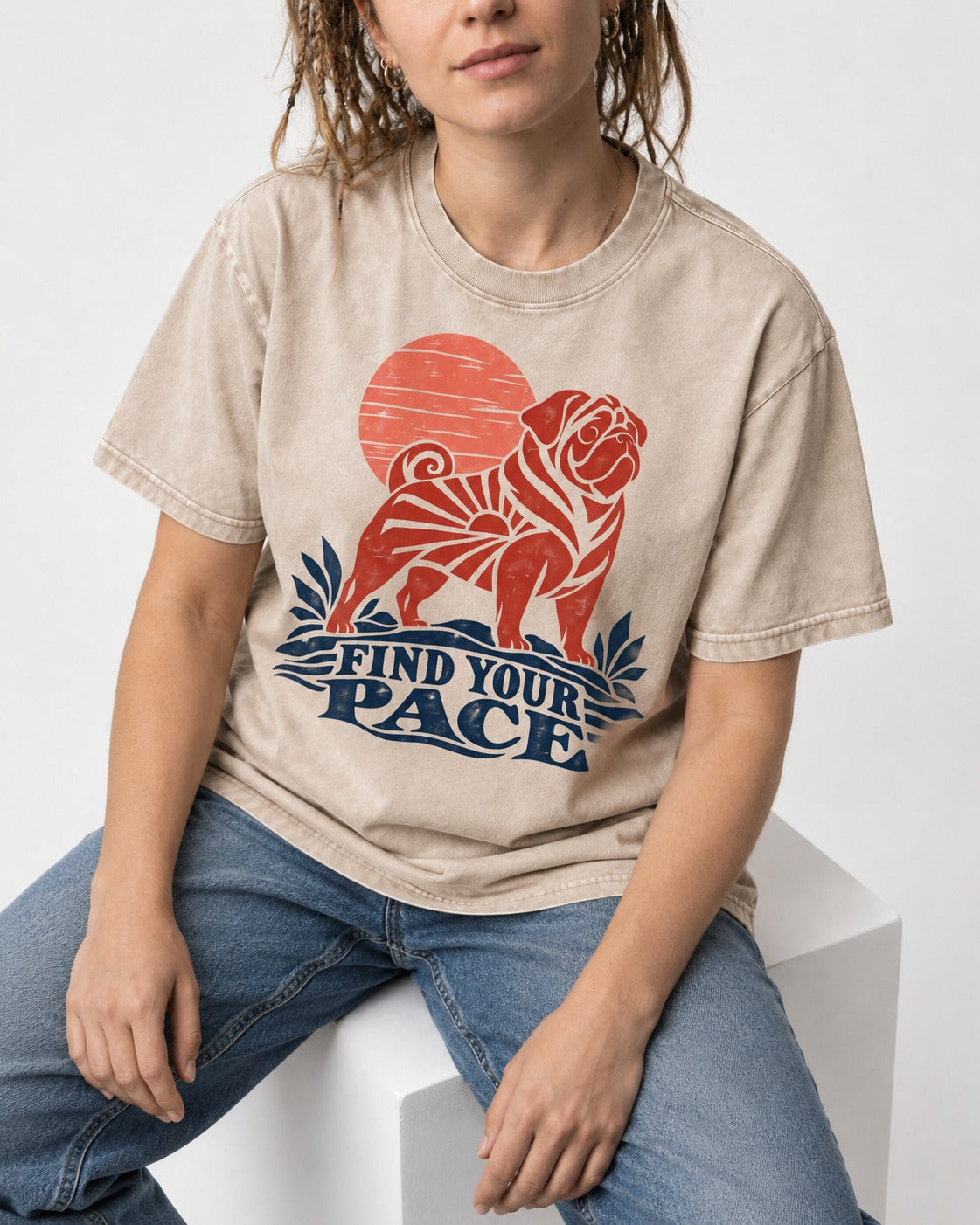 Pug Find Your Pace Sunset Graphic Washed Tee in Apricot, worn by a seated model