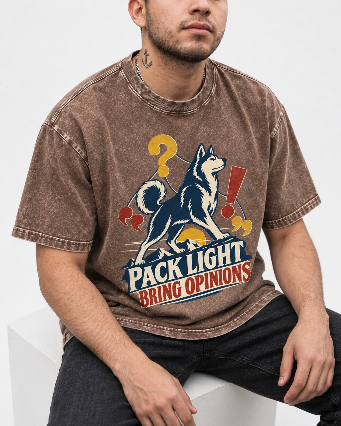 Husky Pack Light Bring Opinions Washed Tee in Coffee, worn by a seated model