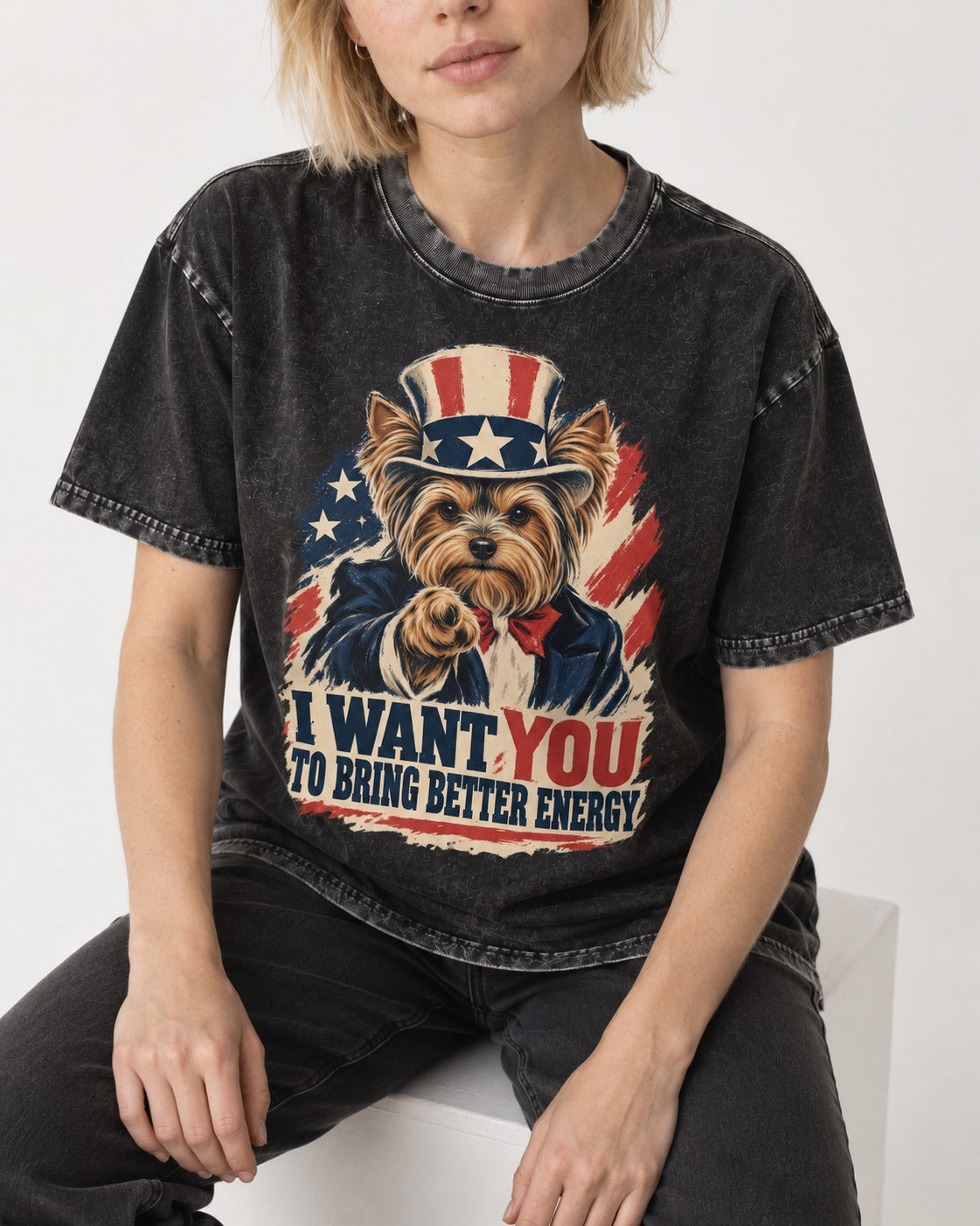 Yorkshire Terrier I Want You to Bring Better Energy Recruitment Poster Graphic Washed Tee in Black, worn by a seated model