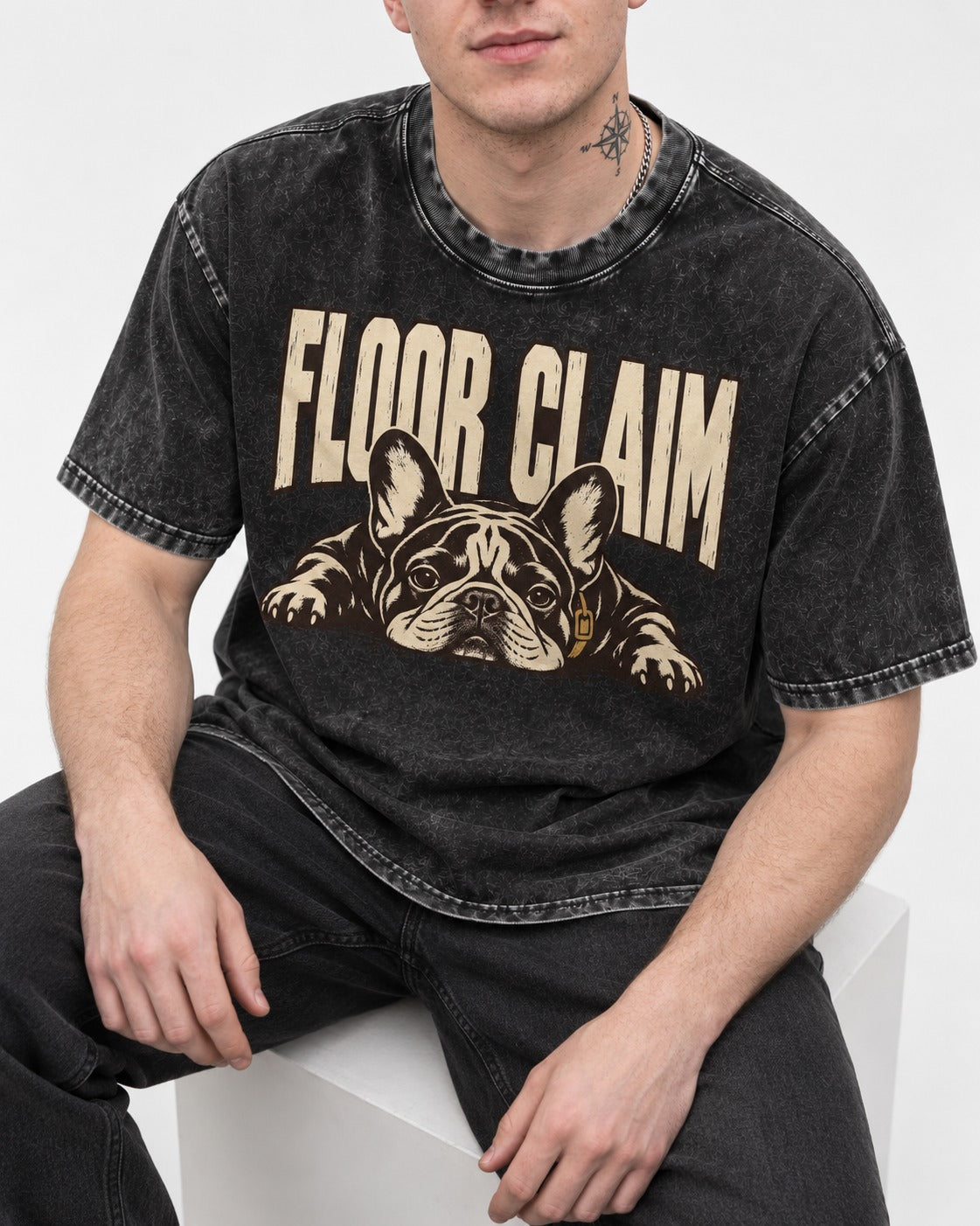 Frenchie Floor Claim Resting Graphic Washed Tee in Black, worn by a seated model