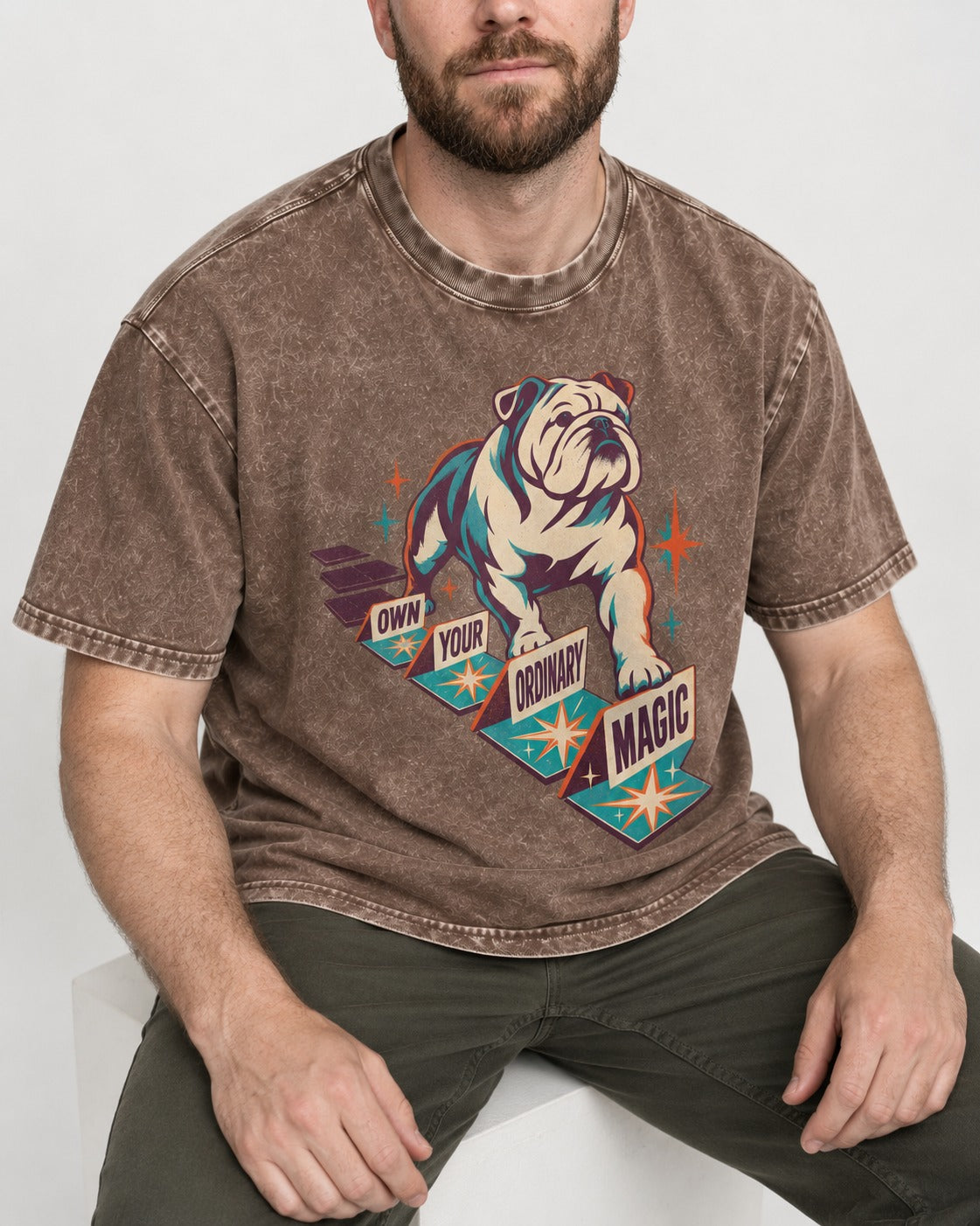English Bulldog's Ordinary Magic Washed Tee in Coffee, worn by a seated model