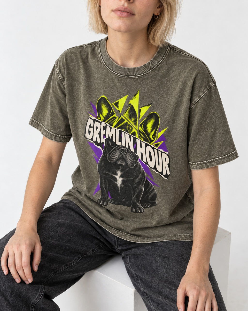Frenchie Gremlin Hour Fracture Portrait Graphic Washed Tee in Army Green, worn by a seated model