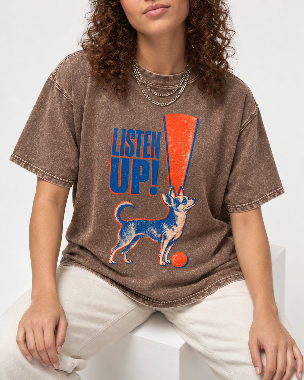 Listen Up Chihuahua Washed Tee in Coffee, worn by a seated model