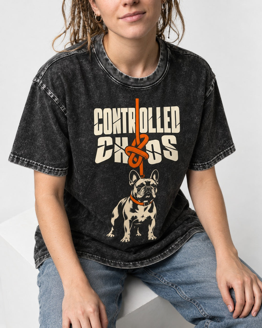 Frenchie Controlled Chaos Leash Knot Graphic Washed Tee in Black, worn by a seated model