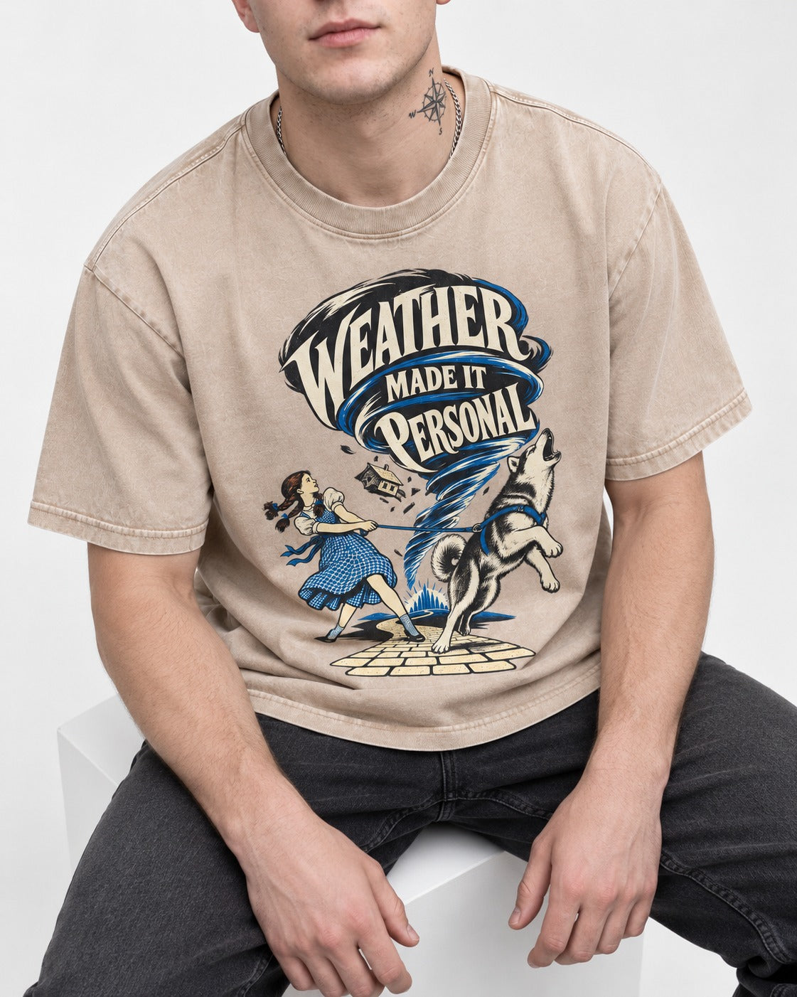 Husky Weather Made It Personal Washed Tee in Apricot, worn by a seated model