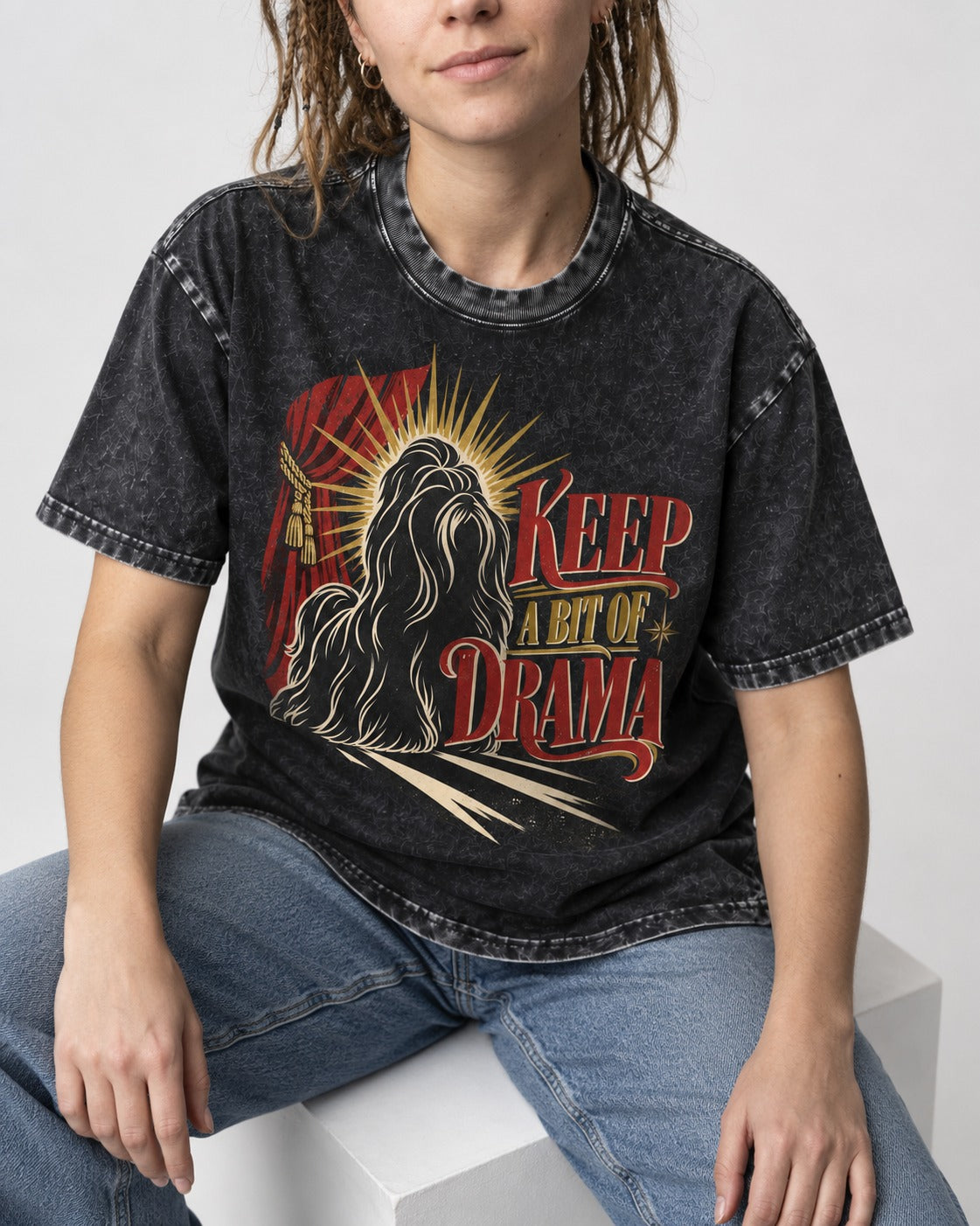 Shih Tzu Keep a Bit of Drama Theater Graphic Washed Tee in Black, worn by a seated model