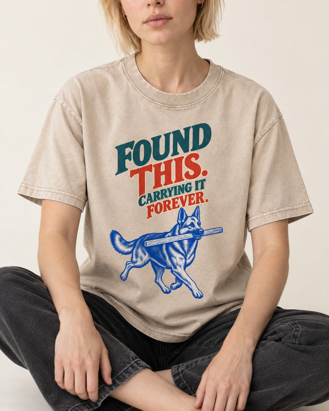 German Shepherd Dog Carrying It Forever Washed Tee in Apricot, worn by a seated model