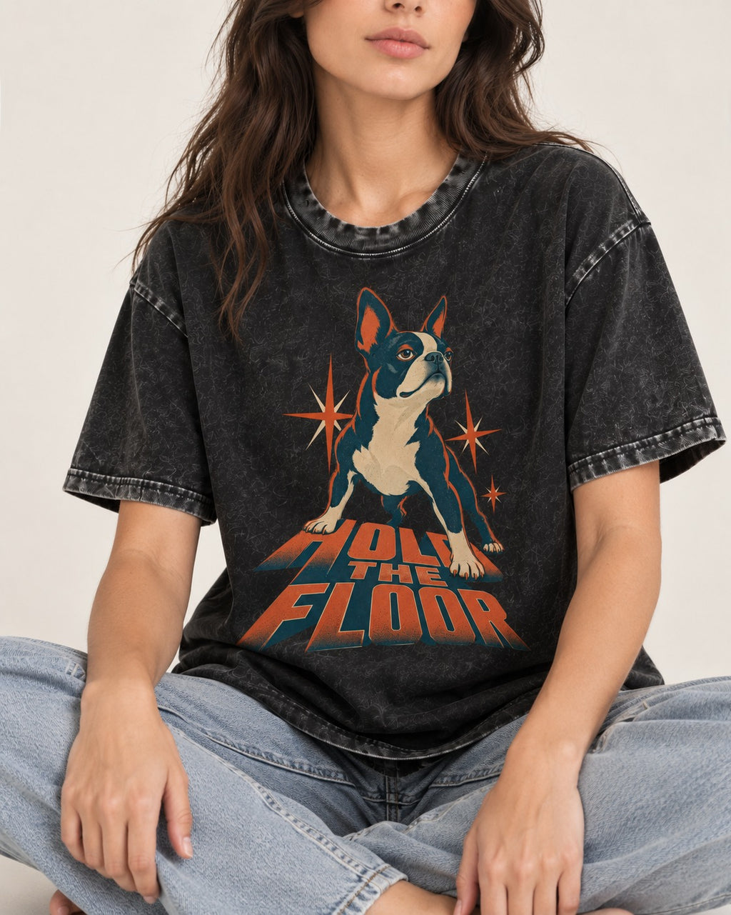 Boston Terrier On The Floor Perspective Graphic Washed Tee in Black, worn by a seated model
