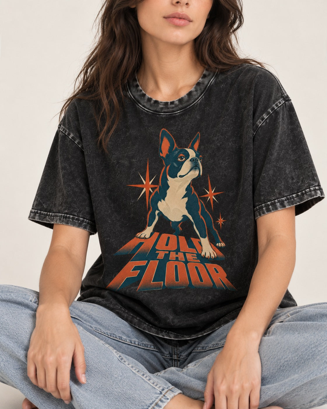Boston Terrier On The Floor Perspective Graphic Washed Tee in Black, worn by a seated model