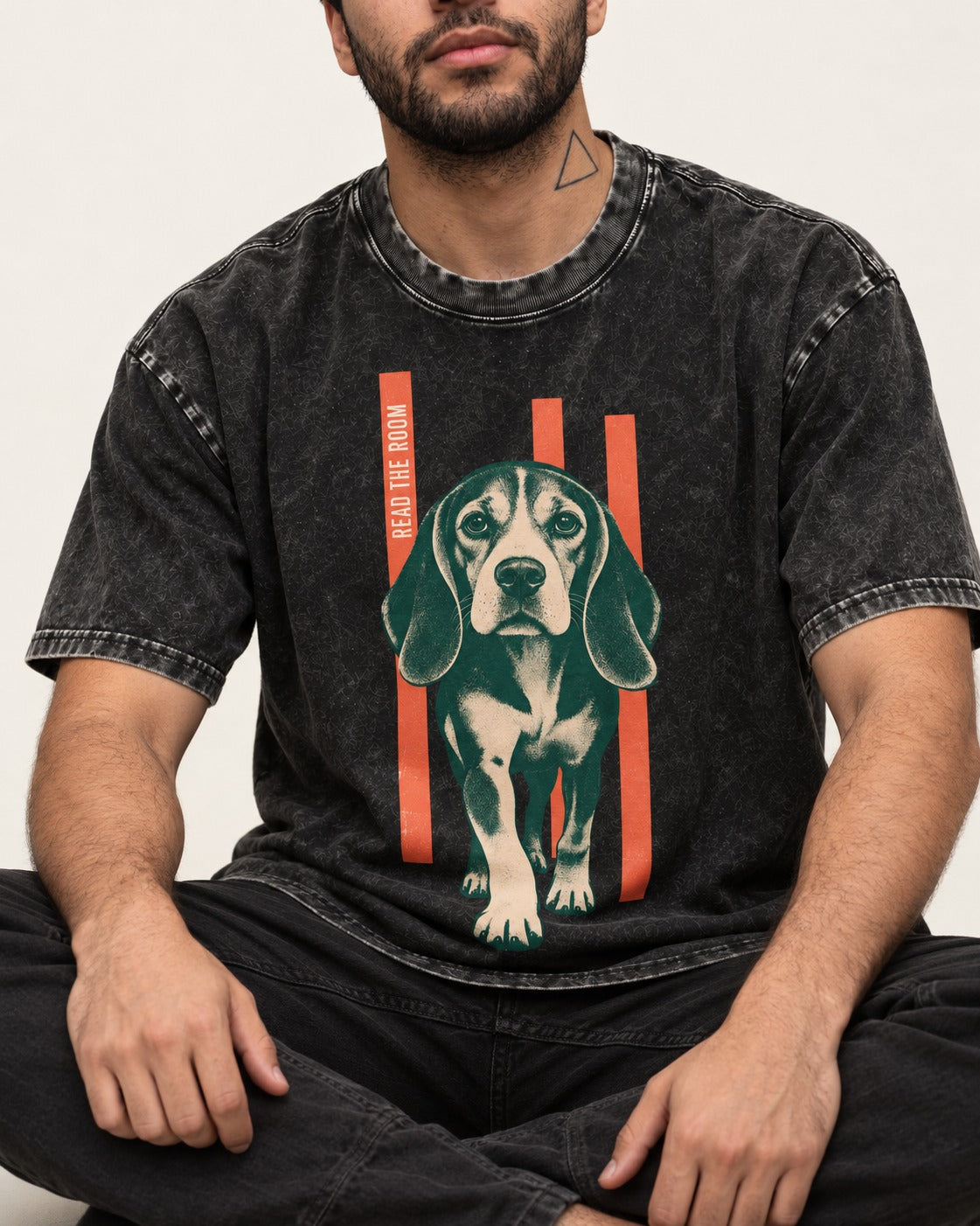 Beagle Before The Move Walking Portrait Washed Tee in Black, worn by a seated model