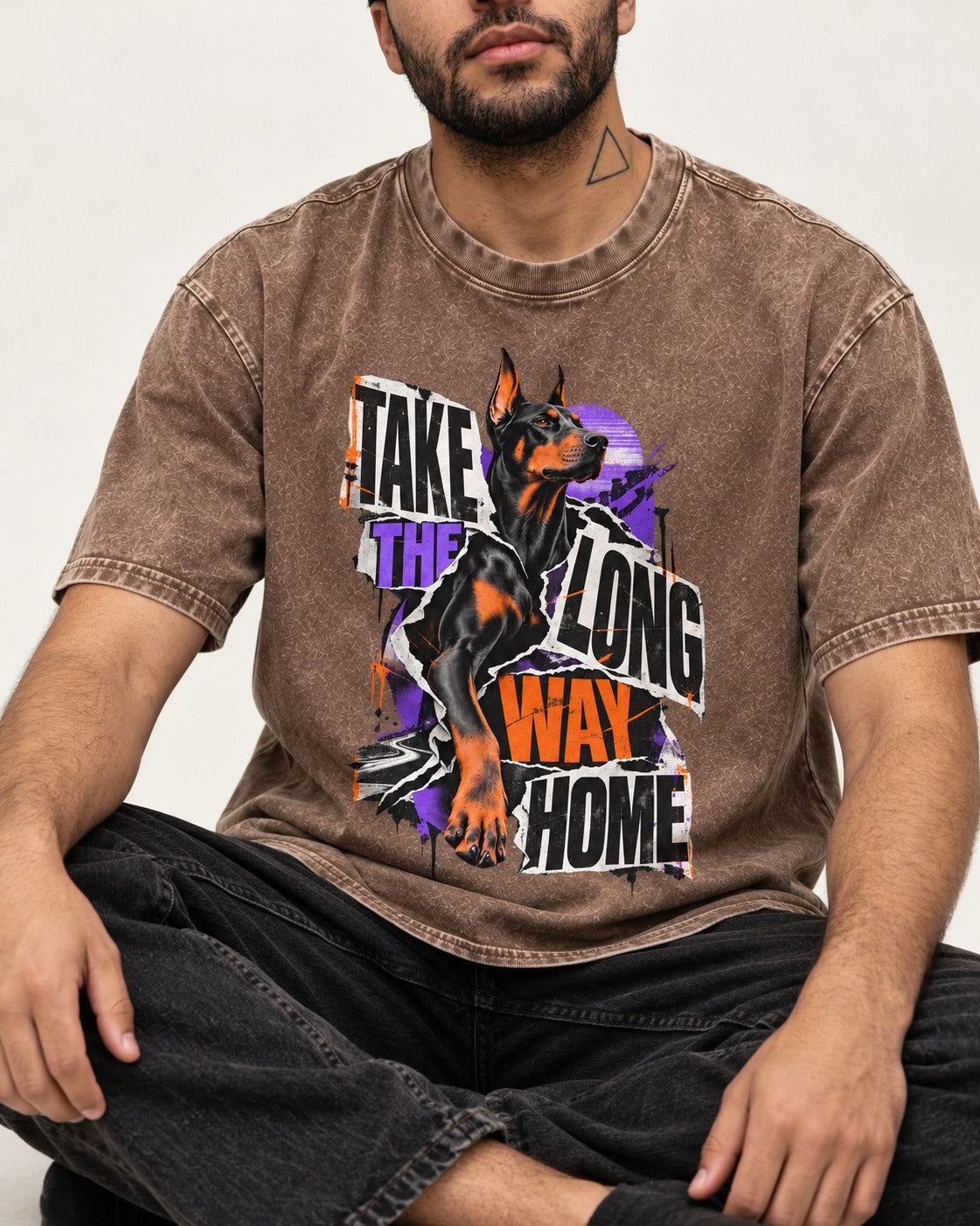 Doberman Long Way Home Washed Tee in Coffee, worn by a seated model