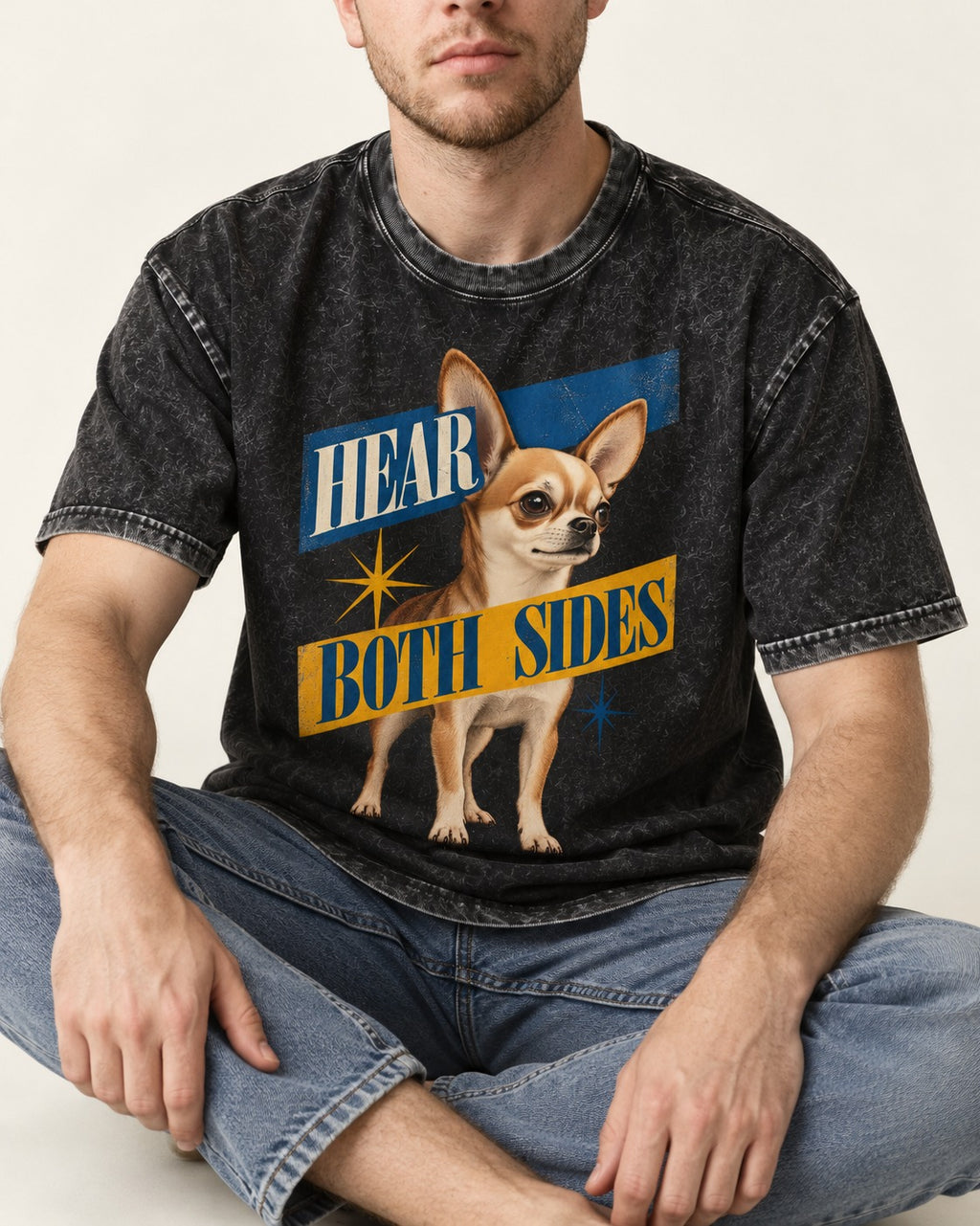 Chihuahua Hear Both Sides Banner Graphic Washed Tee in Black, worn by a seated model