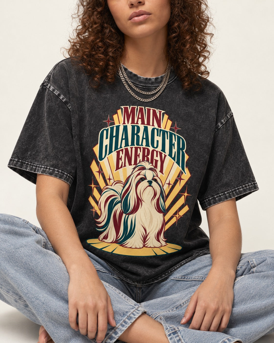 Shih Tzu Main Character Energy Art Deco Graphic Washed Tee in Black, worn by a seated model