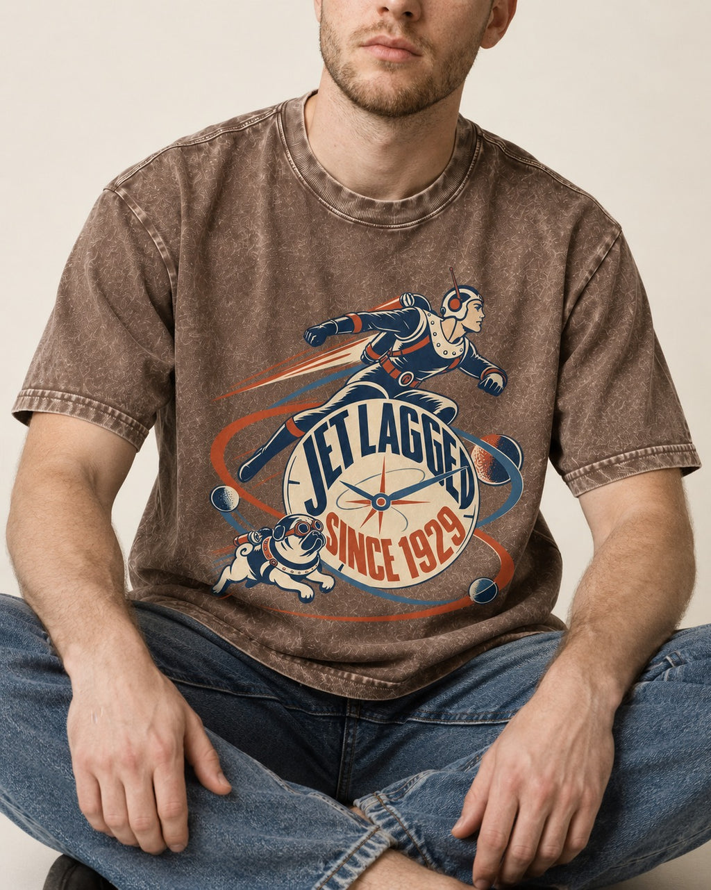 Jet Lagged Pug Washed Tee in Coffee, worn by a seated model
