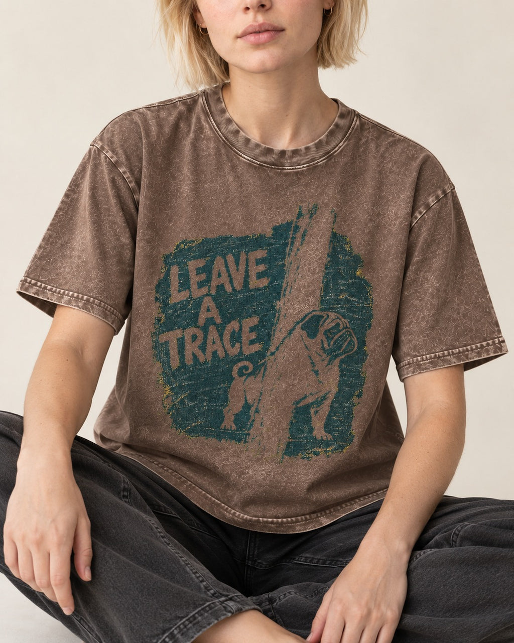 Pug Leaves a Trace Washed Tee in Coffee, worn by a seated model