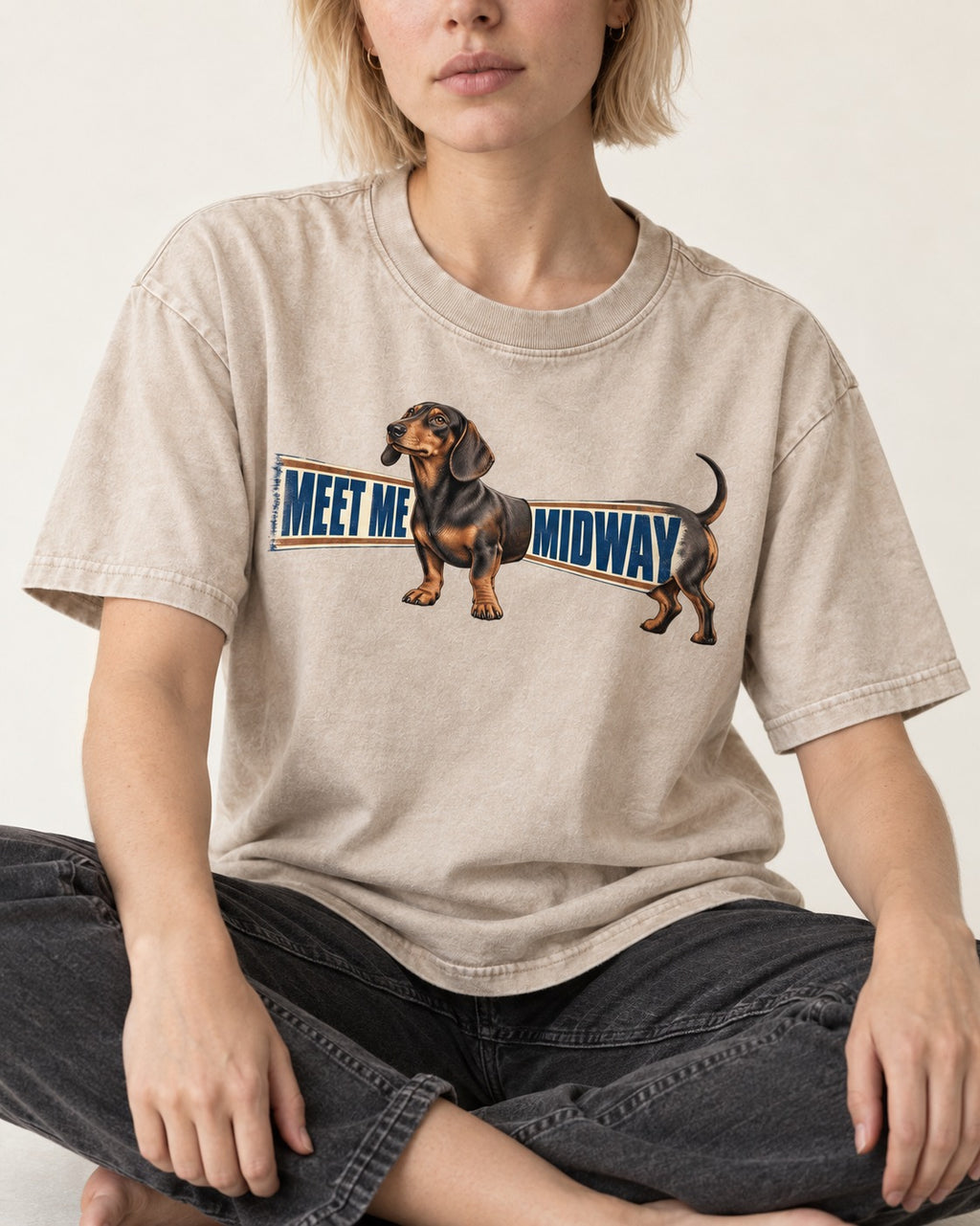 Dachshund Meet Me Midway Washed Tee in Apricot, worn by a seated model