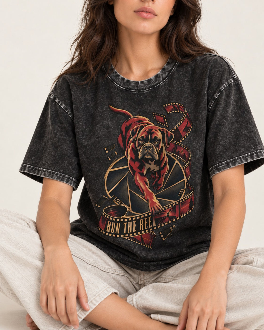 Run the Reel Boxer Film Graphic Washed Tee in Black, worn by a seated model