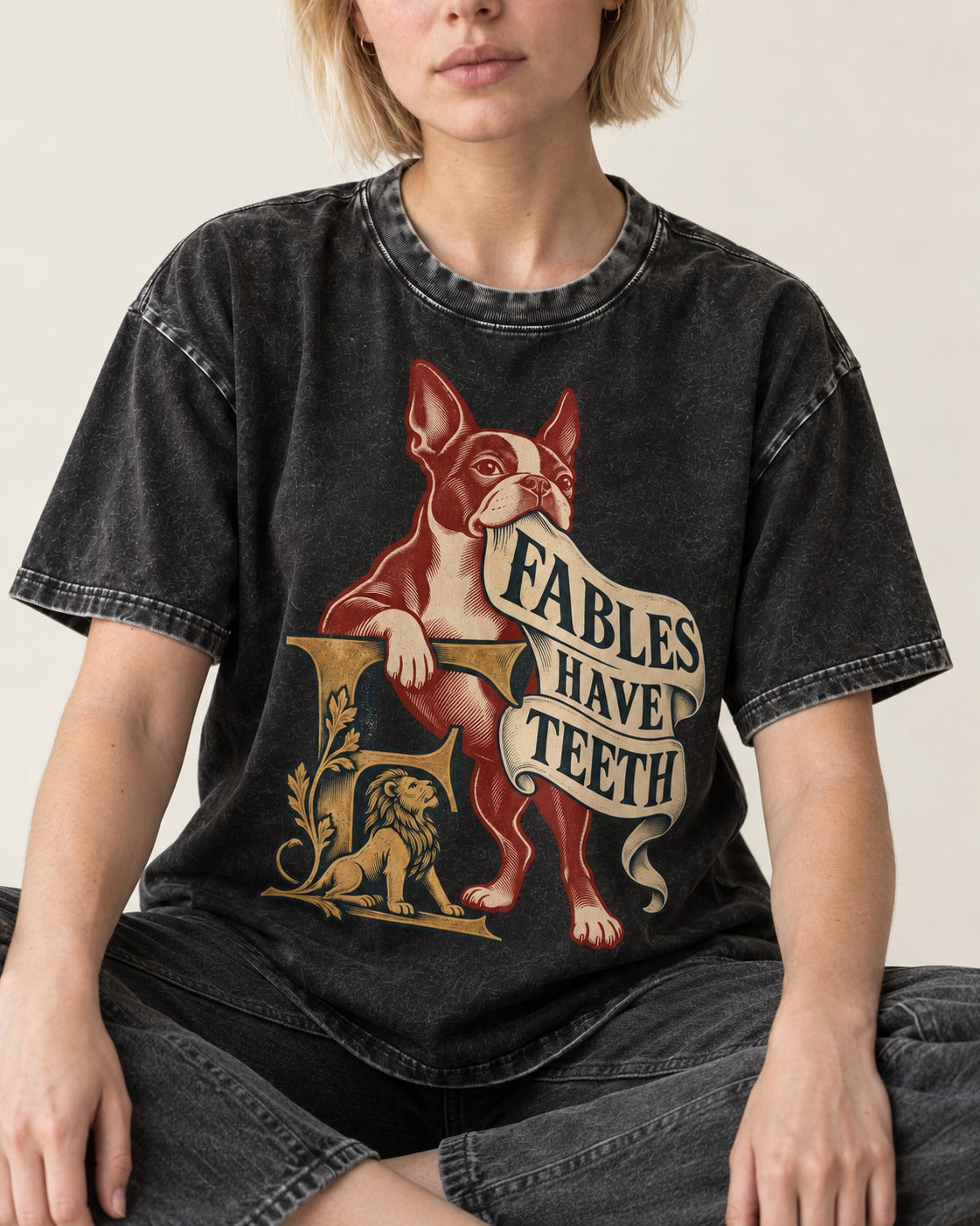 Boston Terrier Fables Have Teeth Washed Tee in Black, worn by a seated model