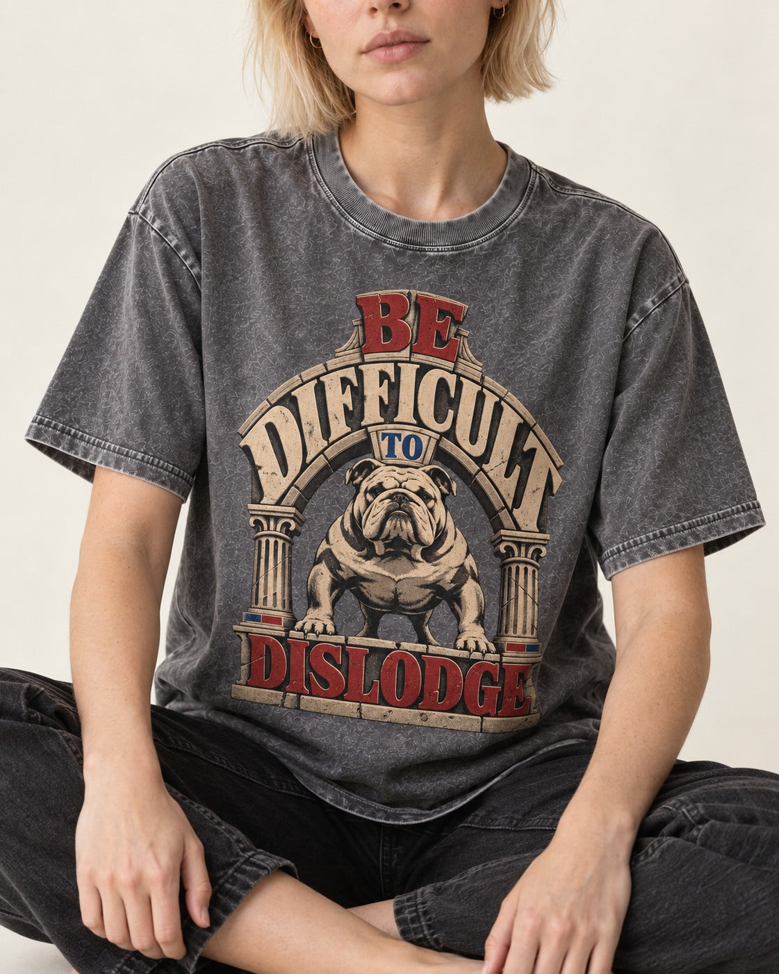 English Bulldog Be Difficult to Dislodge Stone Arch Graphic Washed Tee in Gray, worn by a seated model