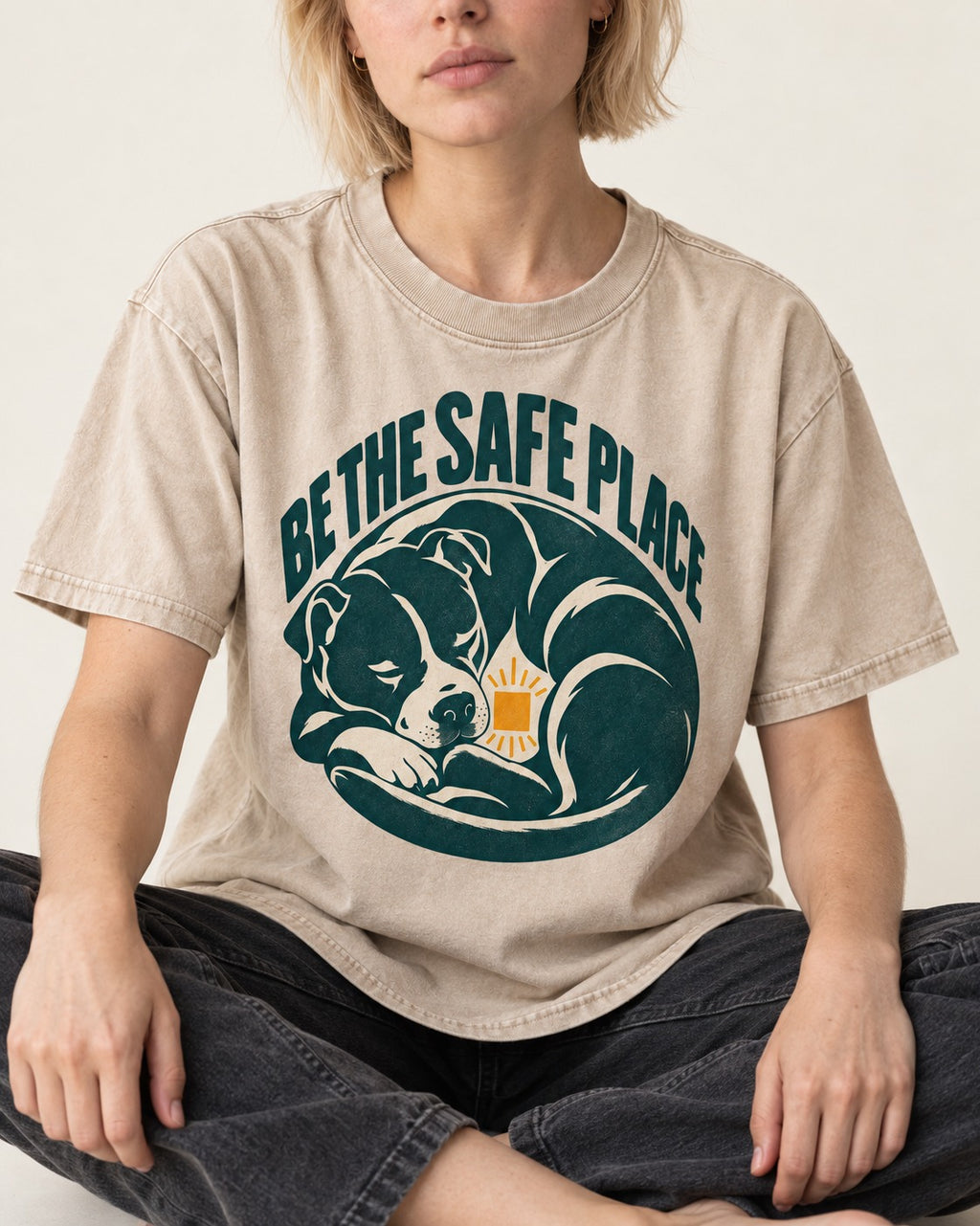 Pitbull Safe Place Washed Tee in Apricot, worn by a seated model