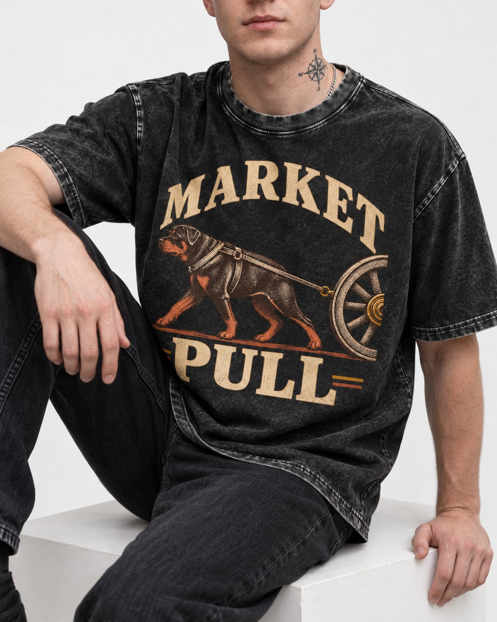 Market Pull Rottweiler Cart Harness Graphic Washed Tee in Black, worn by a seated model