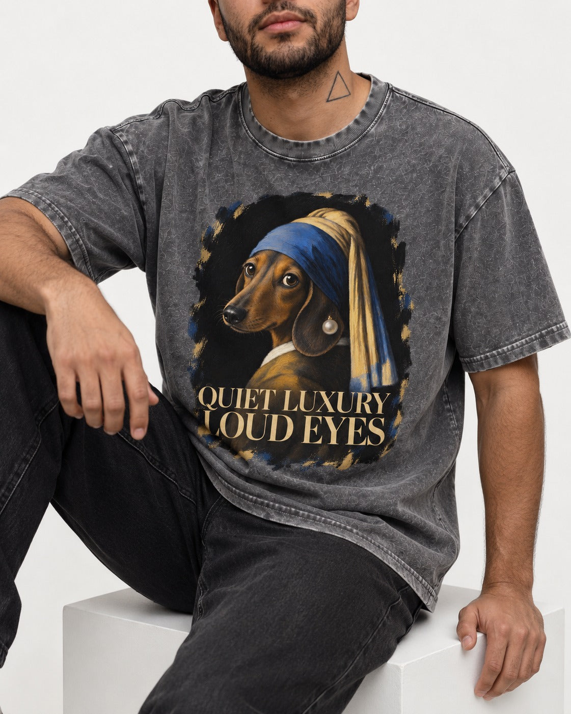 Dachshund Quiet Luxury Loud Eyes Pearl Portrait Graphic Washed Tee in Gray, worn by a seated model