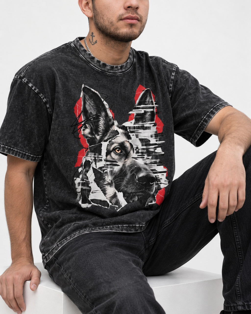 Black Signal Torn Collage German Shepherd Dog Portrait Graphic Washed Tee in Black, worn by a seated model