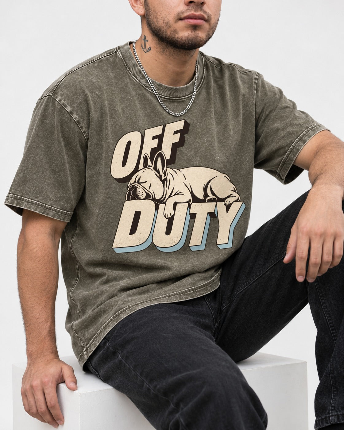 Frenchie Off Duty Sleeping Type Graphic Washed Tee in Army Green, worn by a seated model