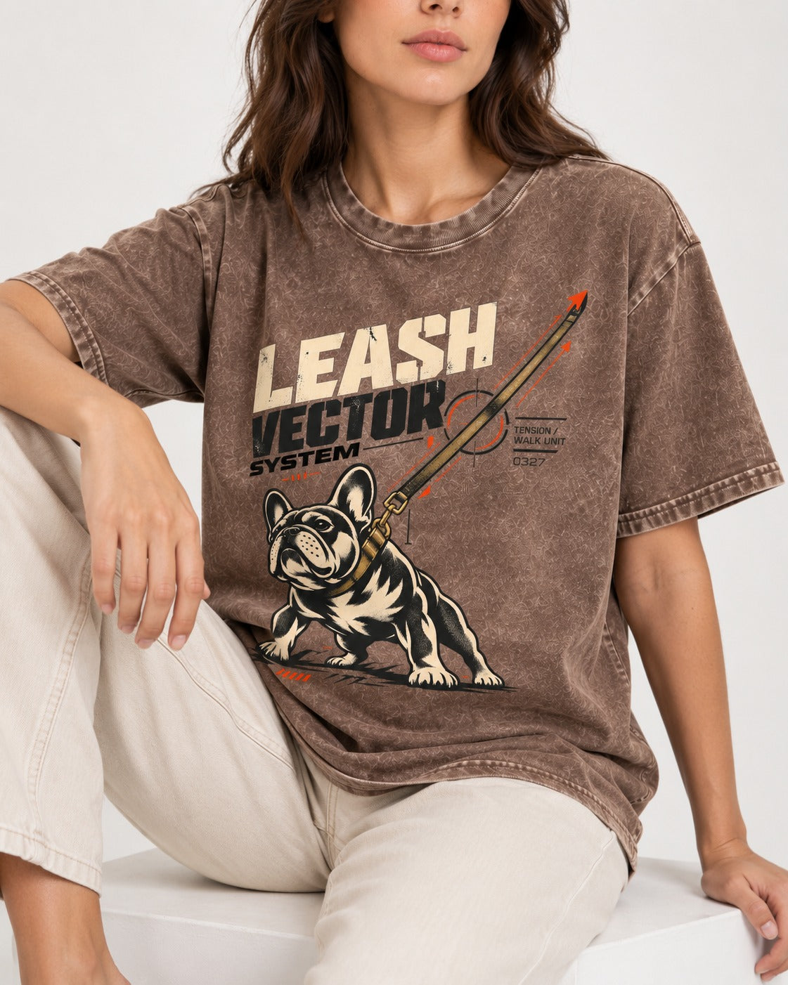 Frenchie Leash Vector Washed Tee in Coffee, worn by a seated model