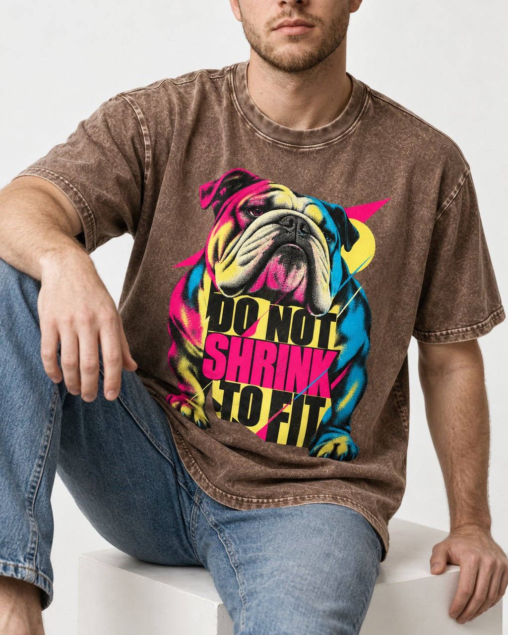 English Bulldog Don't Shrink to Fit Washed Tee in Coffee, worn by a seated model