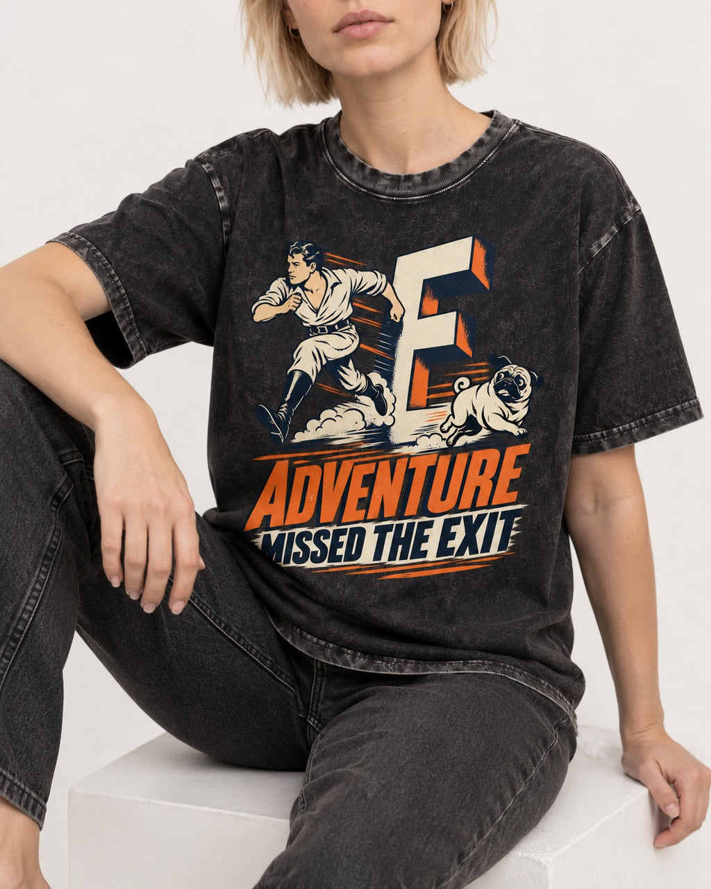 Pug Adventure Missed the Exit Running Graphic Washed Tee in Black, worn by a seated model