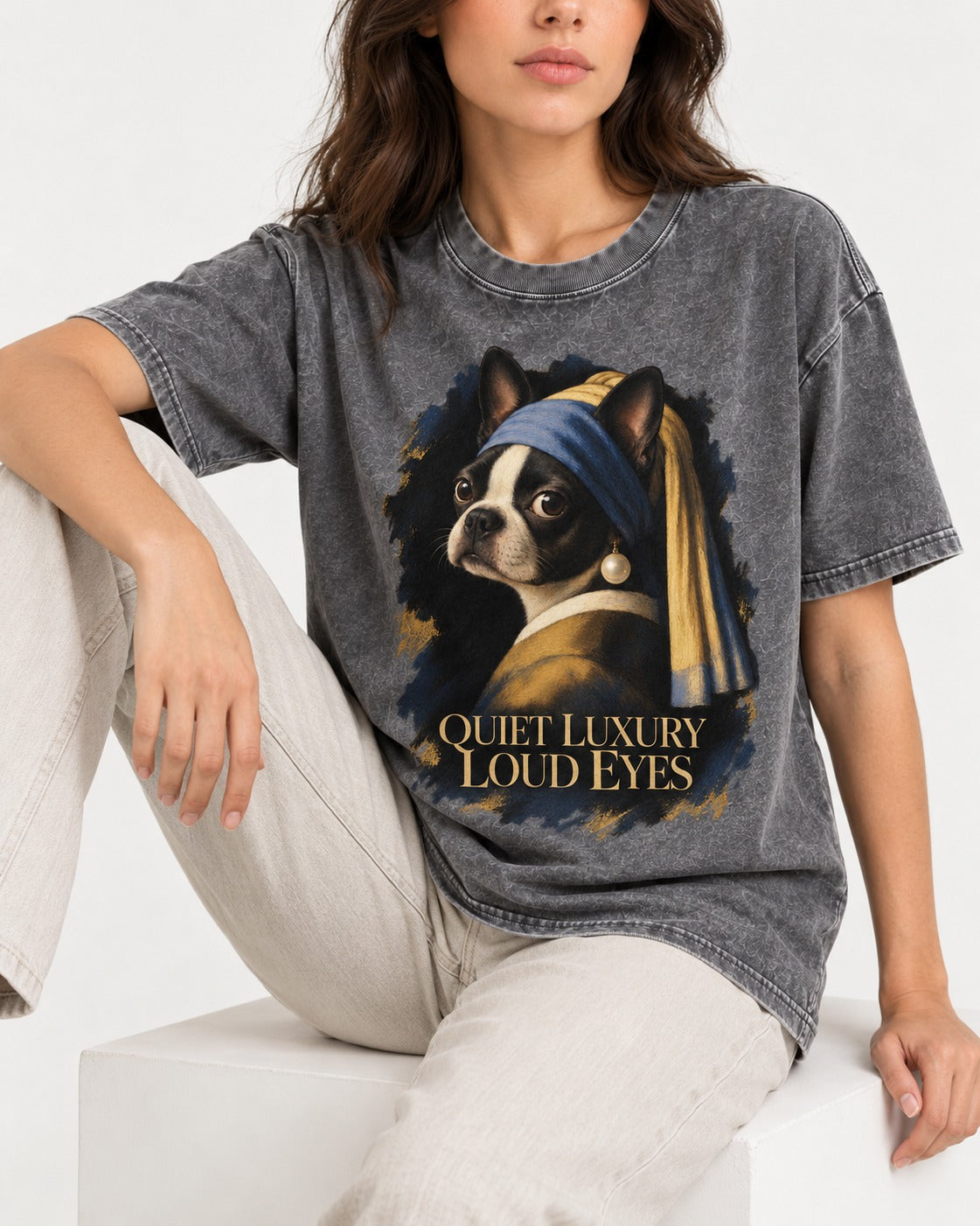 Quiet Luxury Loud Eyes Boston Terrier Pearl Portrait Washed Tee in Gray, worn by a seated model