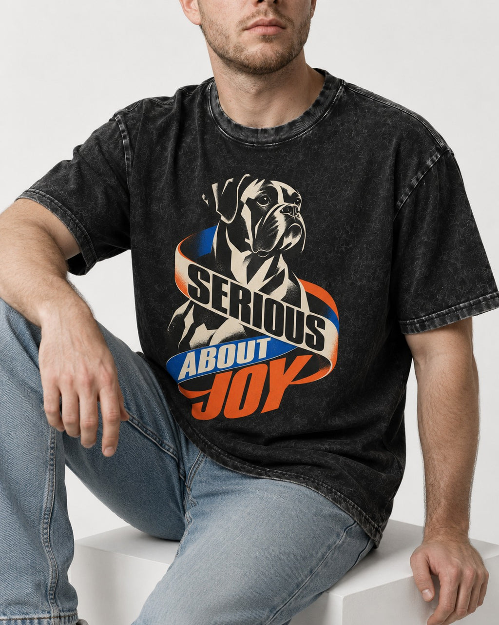 Boxer Serious About Joy Washed Tee in Black, worn by a seated model