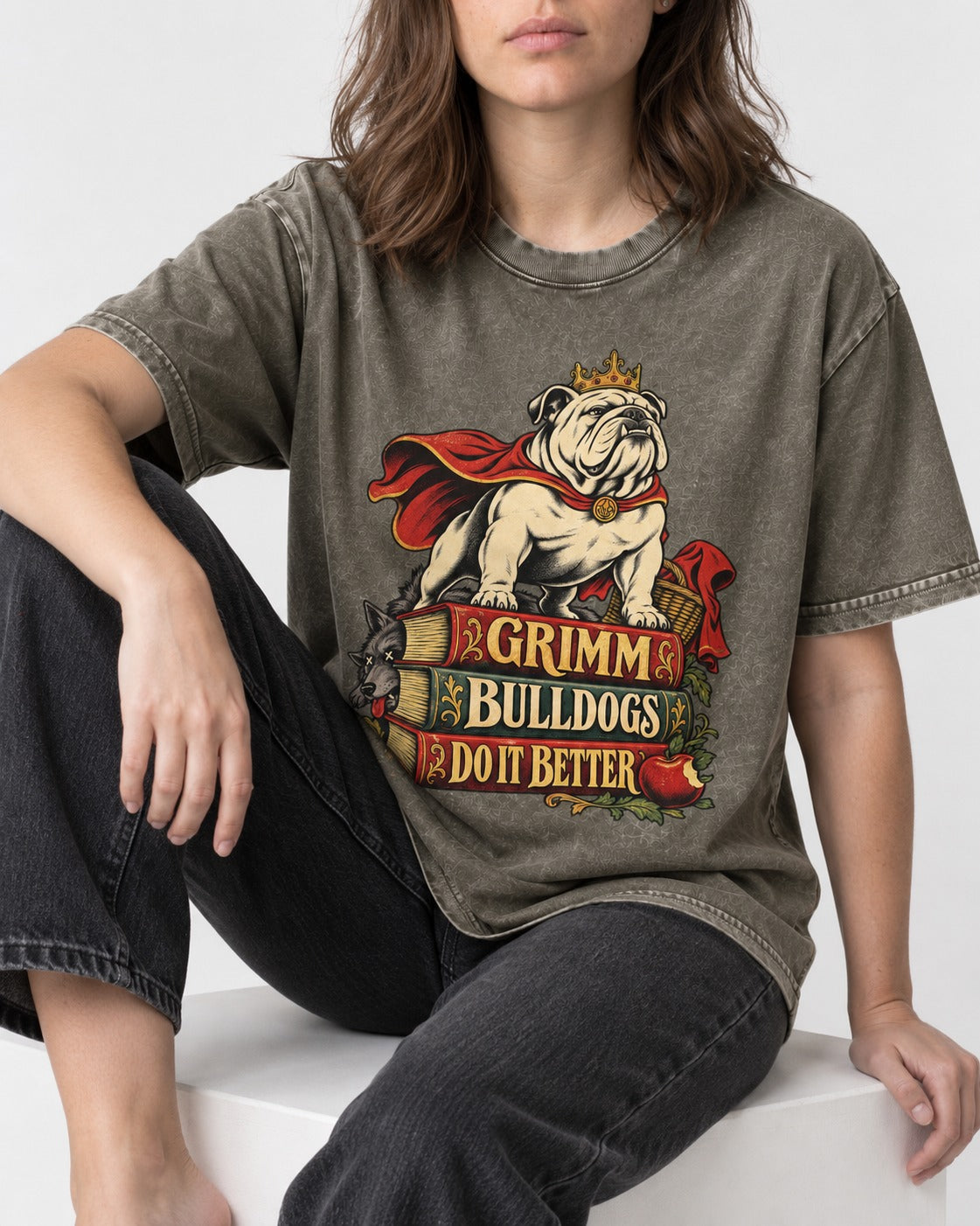 English Bulldog Grimm Bulldogs Do It Better Storybook Graphic Washed Tee in Army Green, worn by a seated model