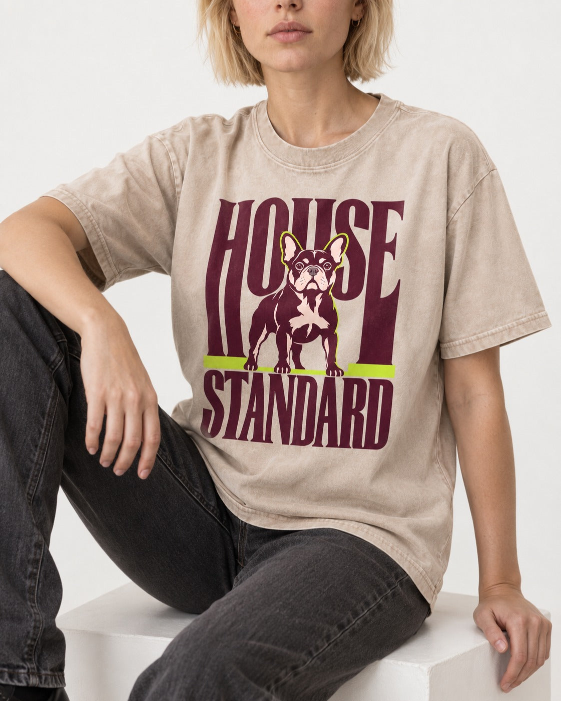 Frenchie House Standard Washed Tee in Apricot, worn by a seated model