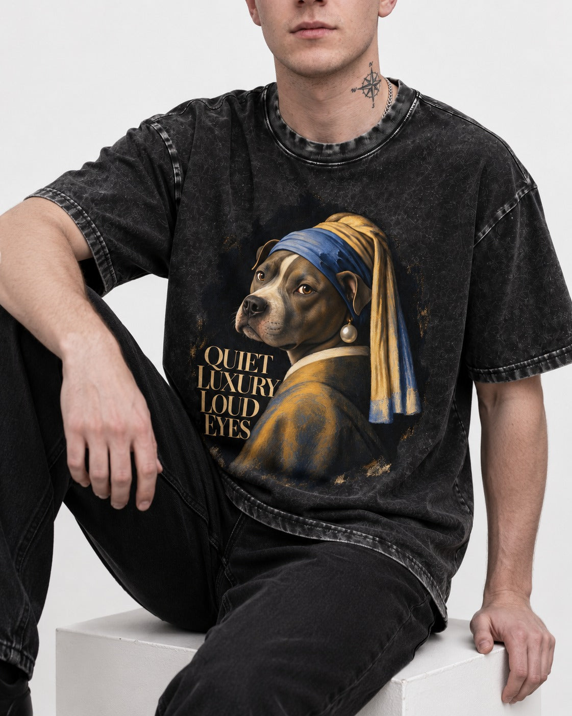 Pitbull Quiet Luxury Loud Eyes Pearl Earring Portrait Graphic Washed Tee in Black, worn by a seated model