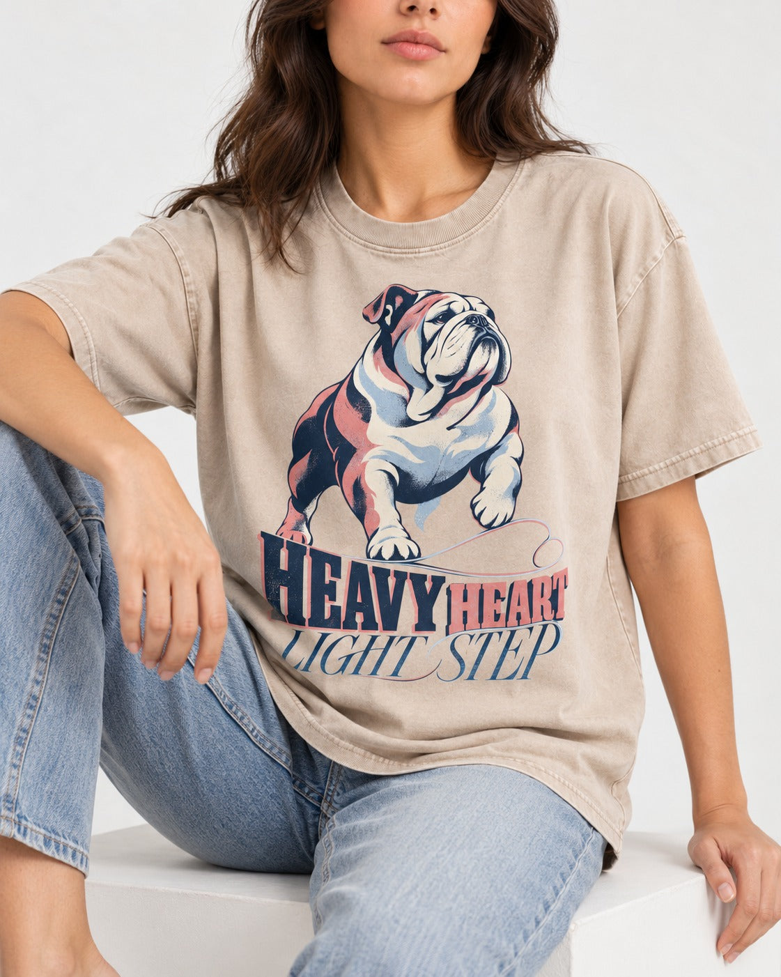 Heavy Heart Light Step English Bulldog Washed Tee in Apricot, worn by a seated model