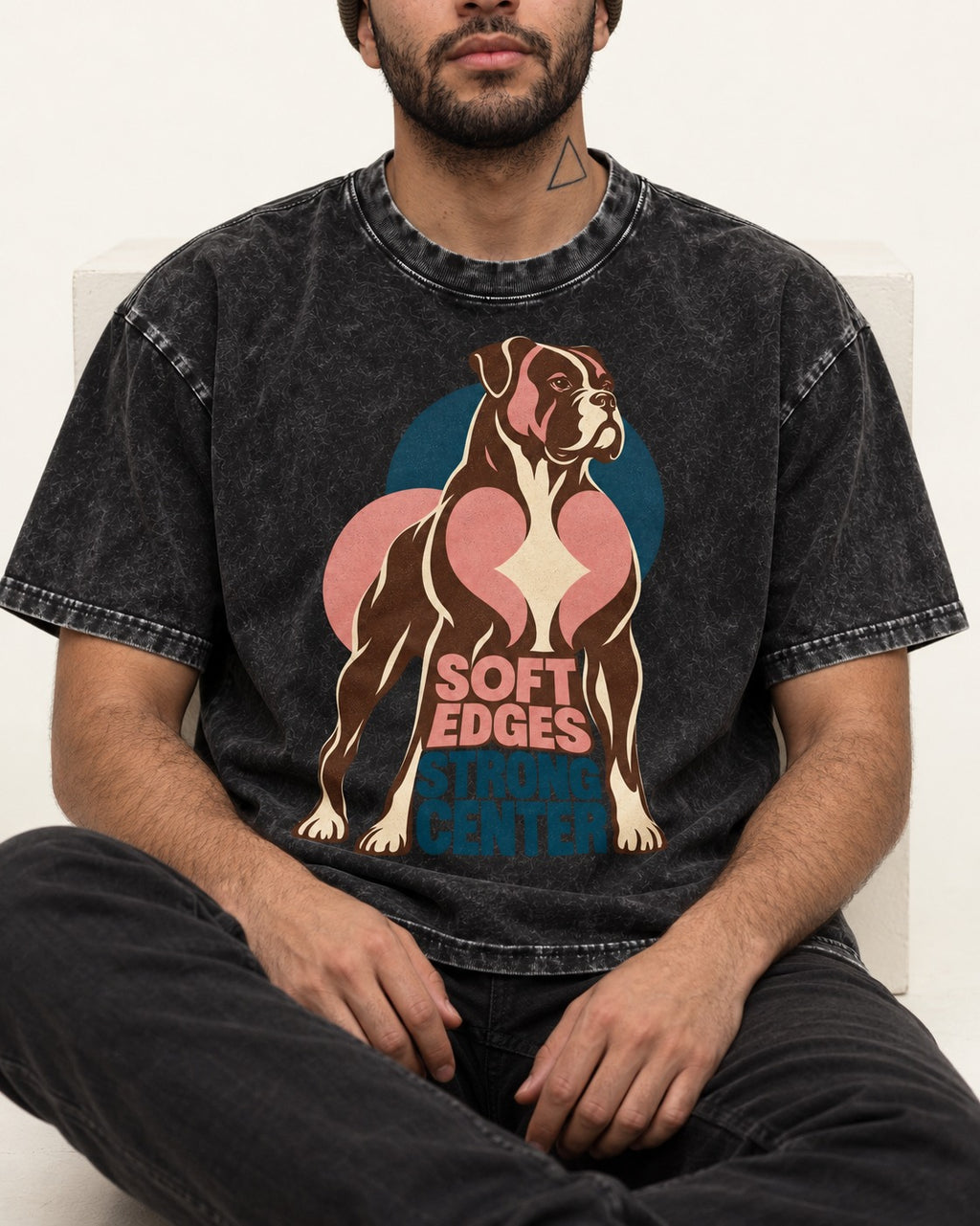 Boxer Soft Edges Strong Center Washed Tee in Black, worn by a seated model