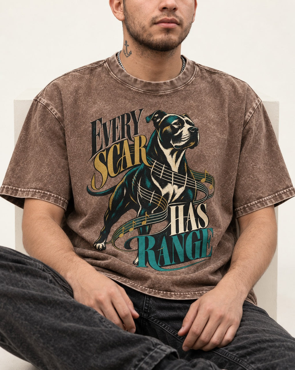 Every Pitbull Scar Has Range Washed Tee in Coffee, worn by a seated model