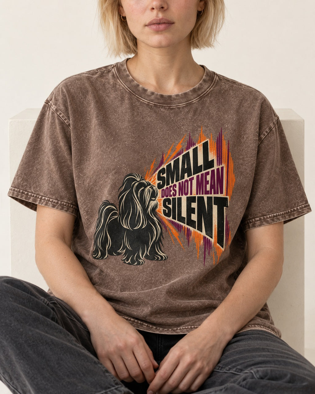 Small Not Silent Shih Tzu Washed Tee in Coffee, worn by a seated model