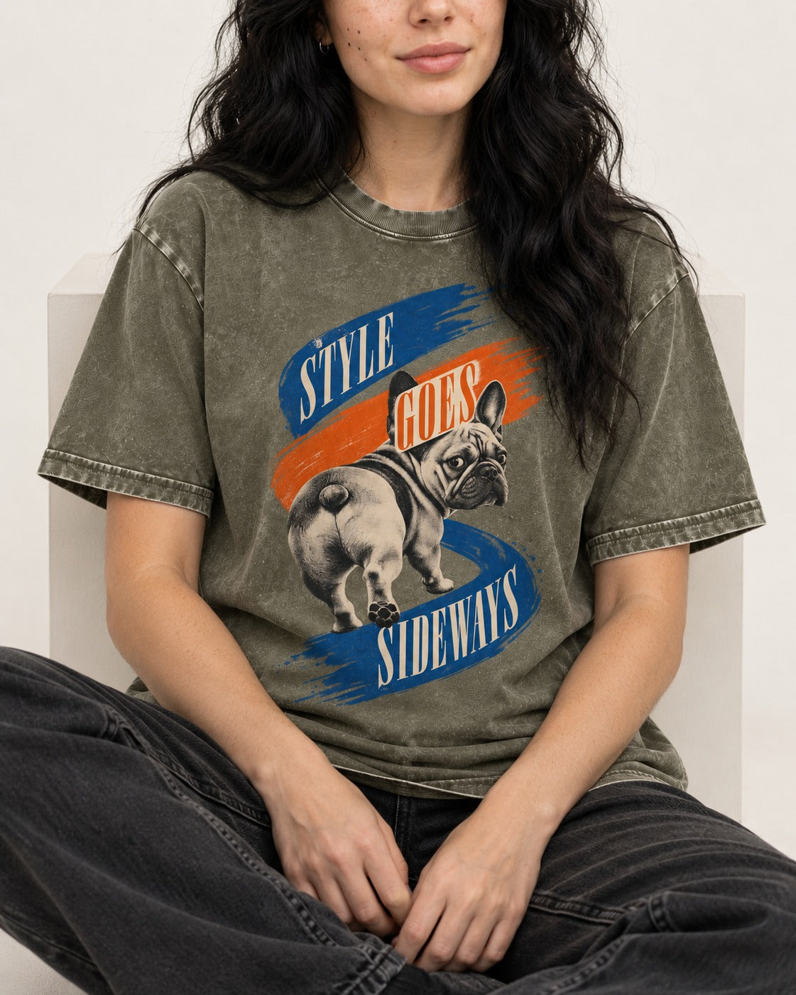 Frenchie Style Goes Sideways Graphic Washed Tee in Army Green, worn by a seated model