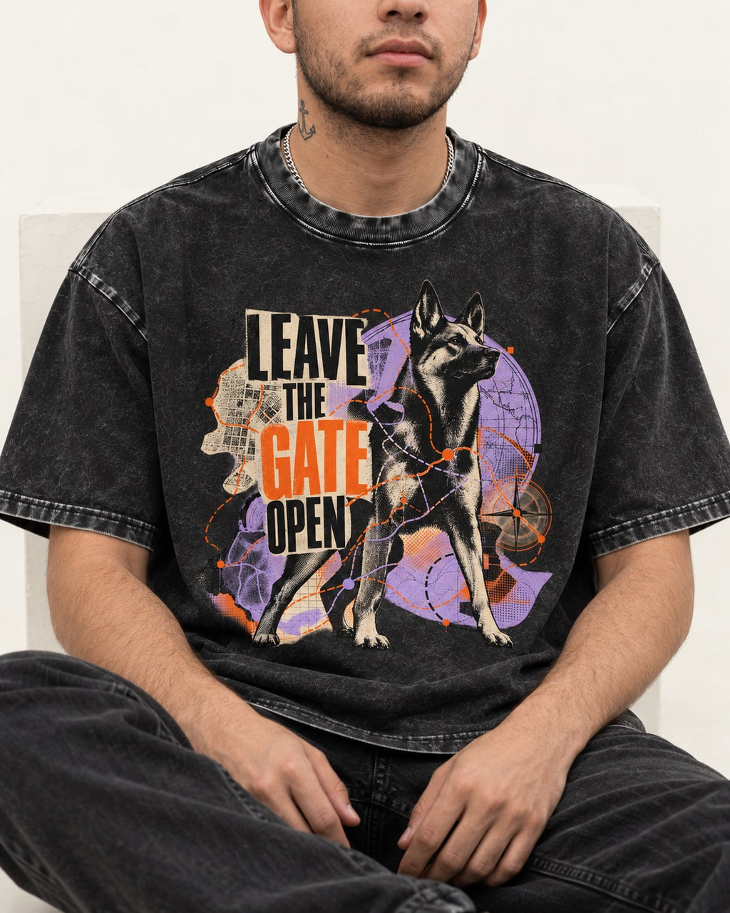 Leave The Gate Open Transit Collage German Shepherd Dog Graphic Washed Tee in Black, worn by a seated model