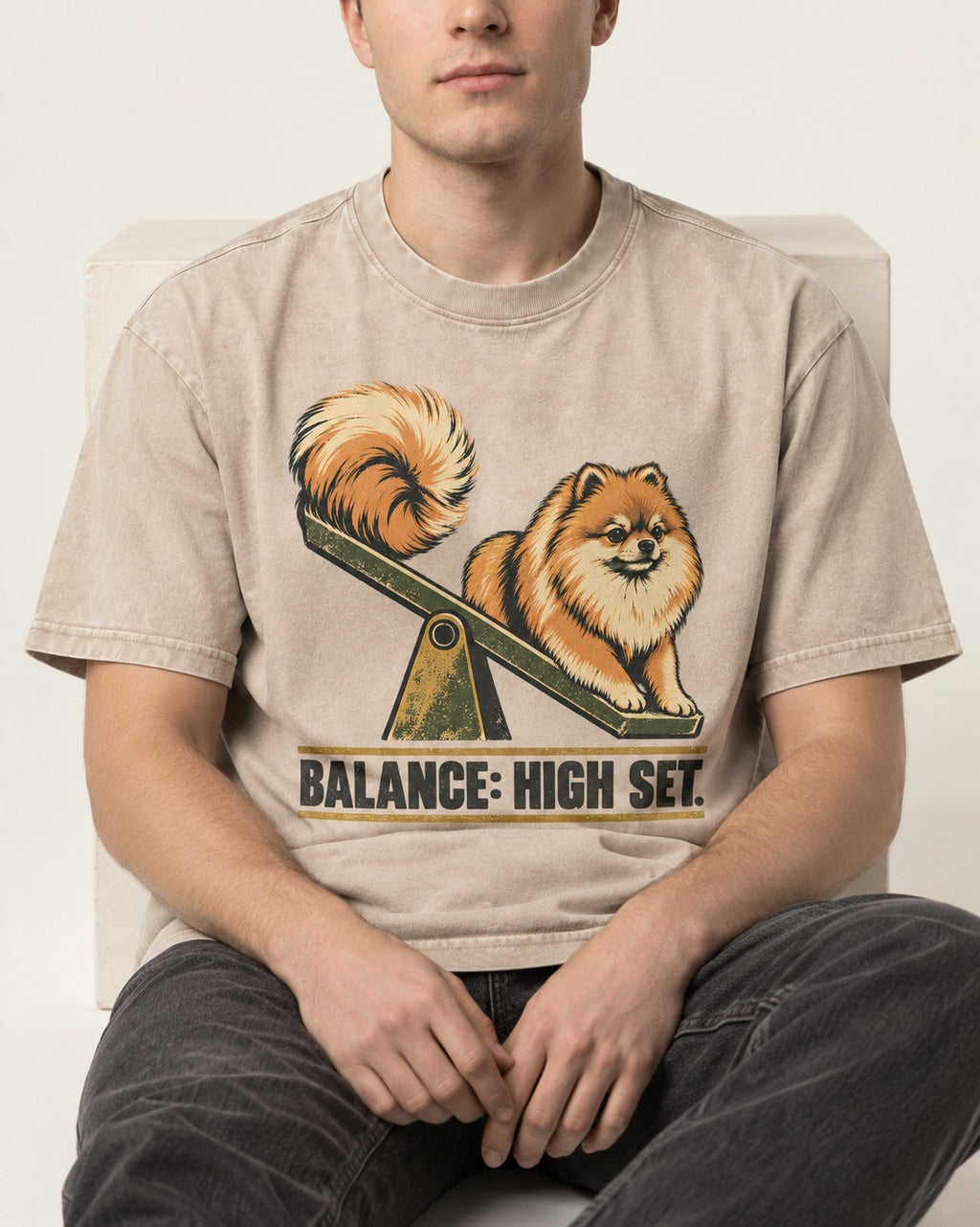 Pomeranian Balance High Set Washed Tee in Apricot, worn by a seated model