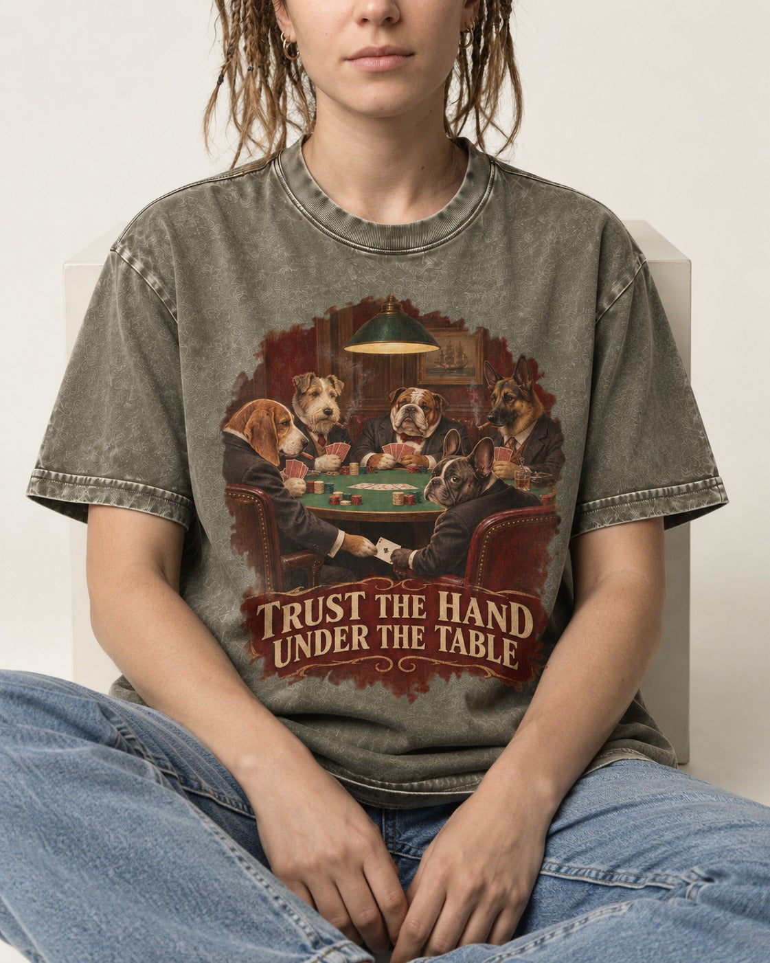 Frenchie Trust the Hand Under the Table Poker Dogs Graphic Washed Tee in Army Green, worn by a seated model