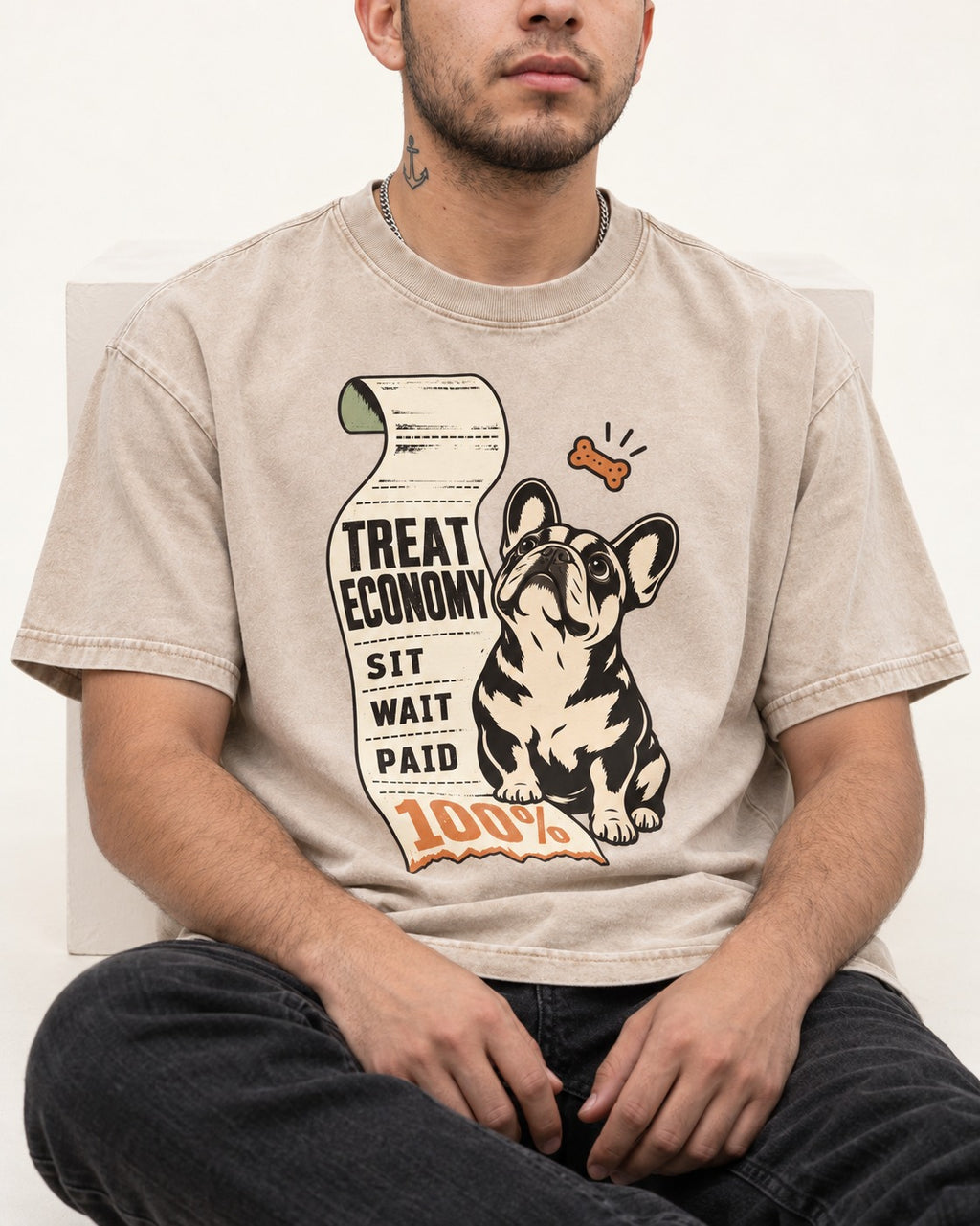 Sit Wait Paid Frenchie Washed Tee in Apricot, worn by a seated model