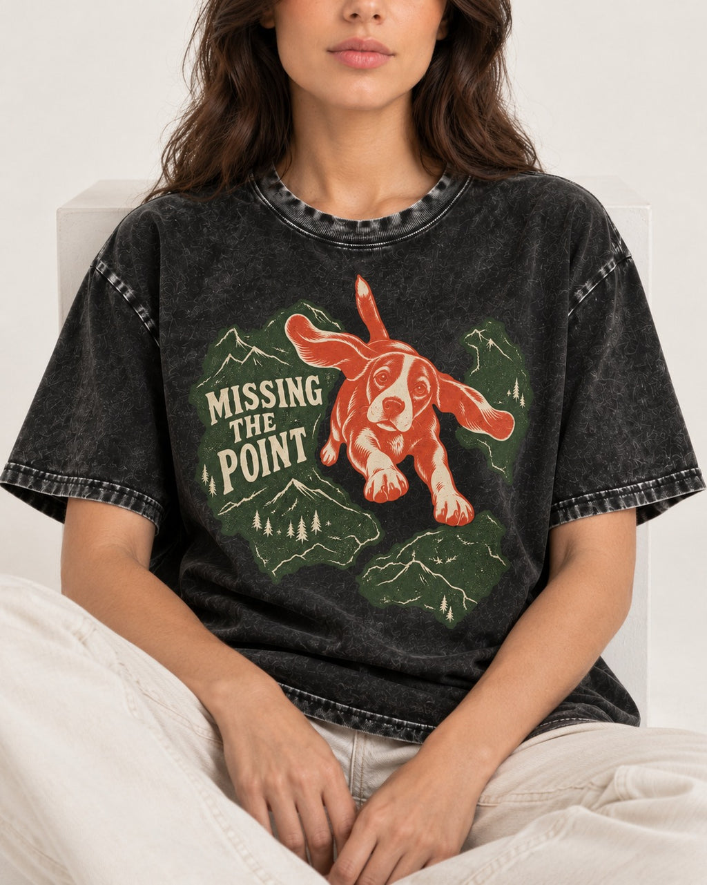 Missing The Point Beagle Trail Washed Tee in Black, worn by a seated model