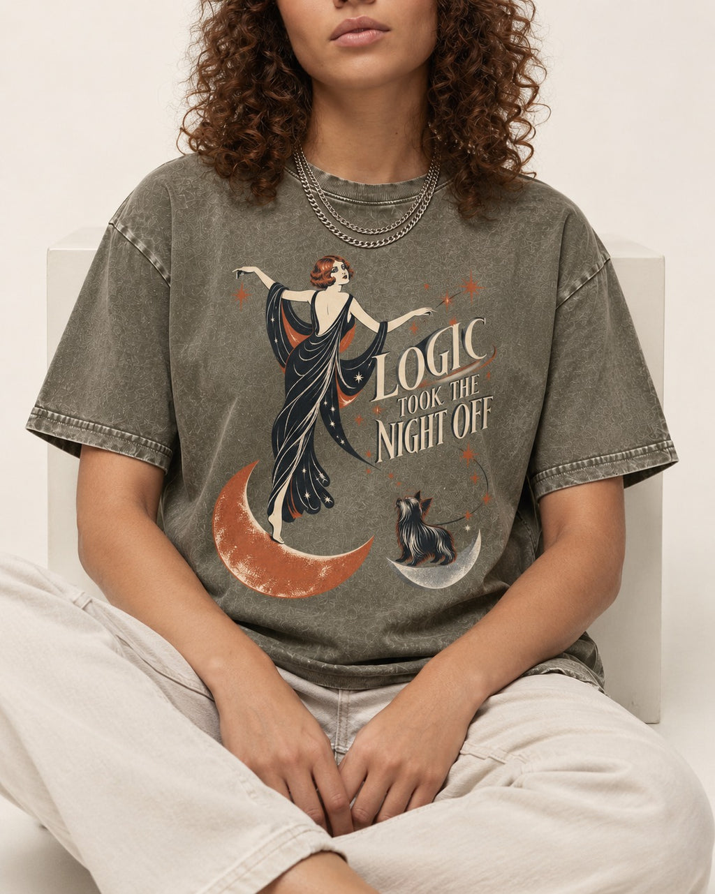 Yorkshire Terrier Logic Took the Night Off Art Deco Graphic Washed Tee in Army Green, worn by a seated model